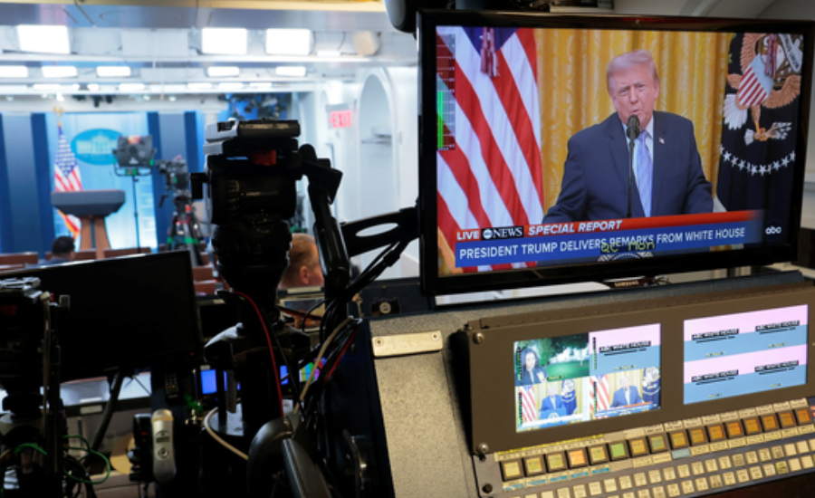 A studio monitor and broadcast camera showing ABC News' live coverage of President Trump delivering remarks from the White House.