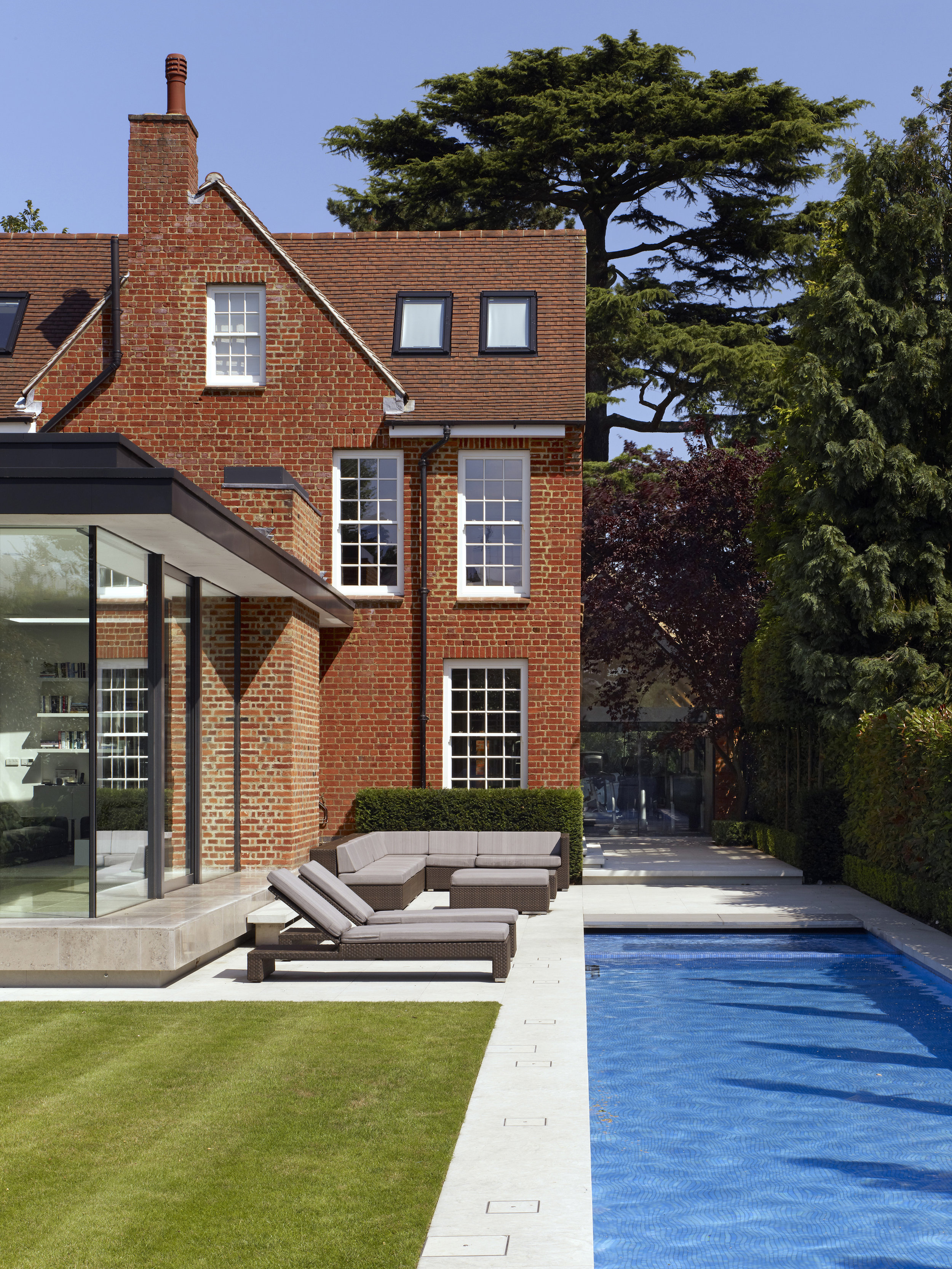 Award Winning Luxury House Renovation London, including swimming pool jacuzzi car lift and gym, by minimalist London architect practice Thompson + Baroni