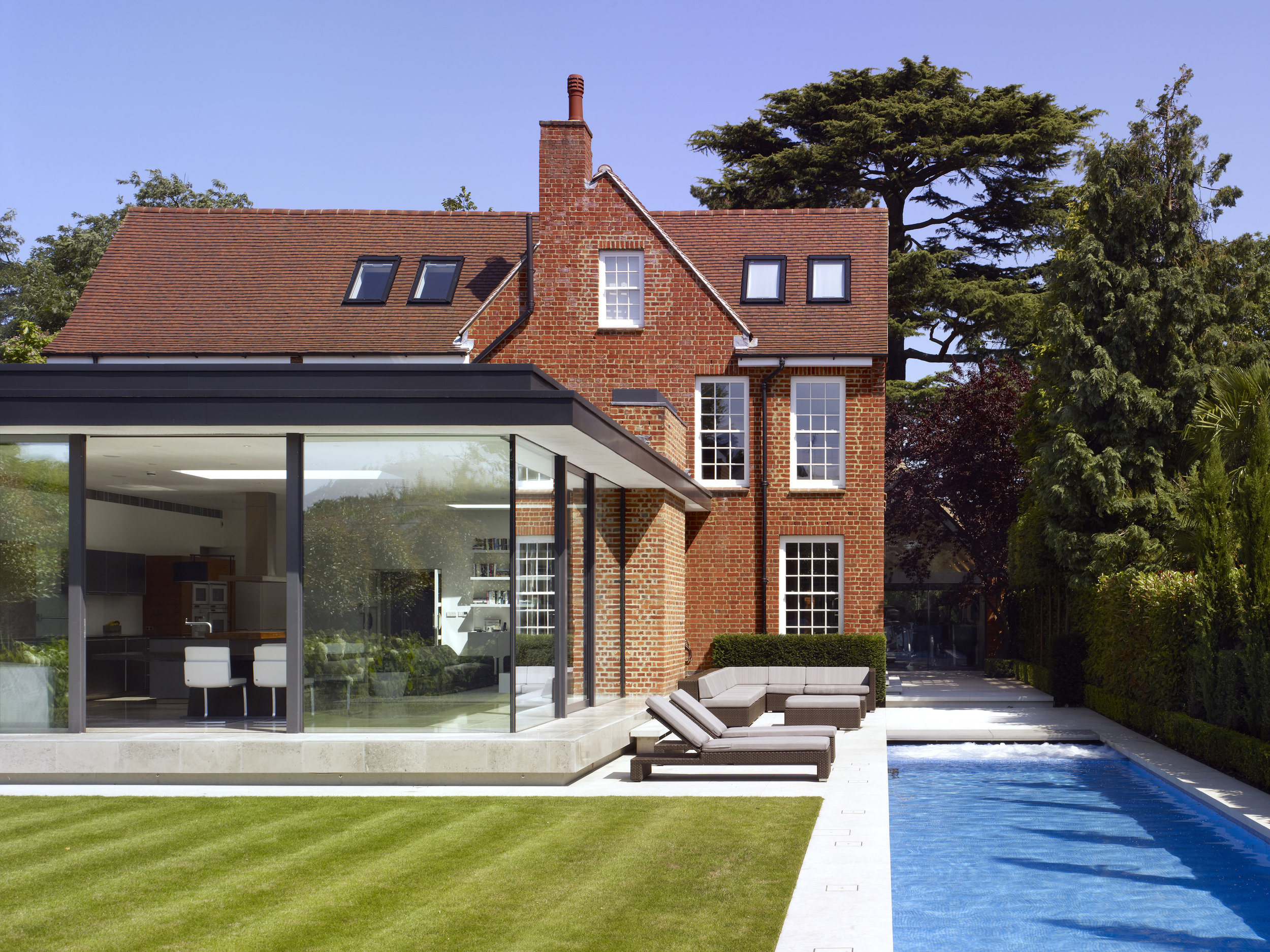 Award Winning Luxury House Renovation London, including swimming pool jacuzzi car lift and gym, by minimalist London architect practice Thompson + Baroni