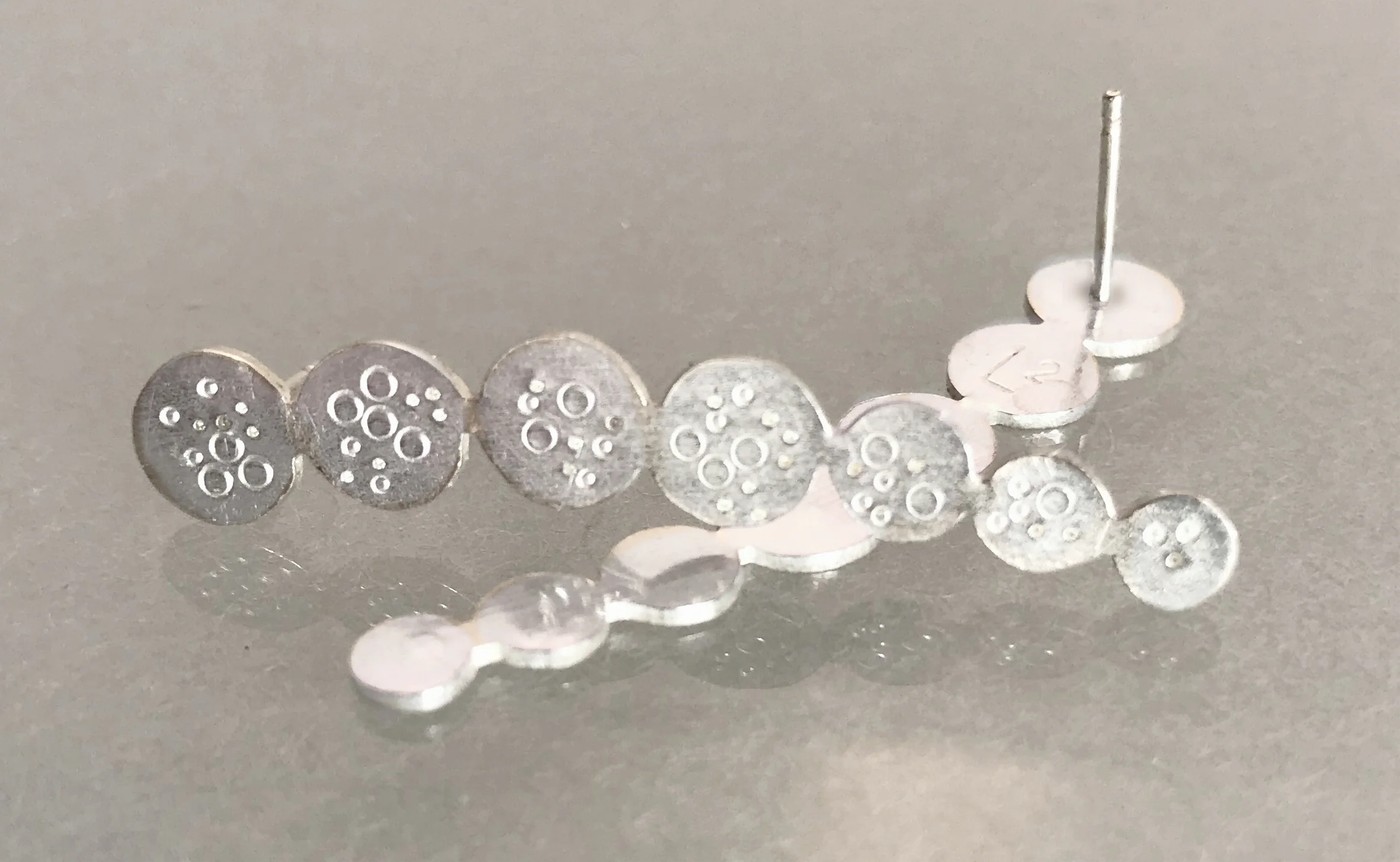 Line of 7 Circles Studs:2.jpg