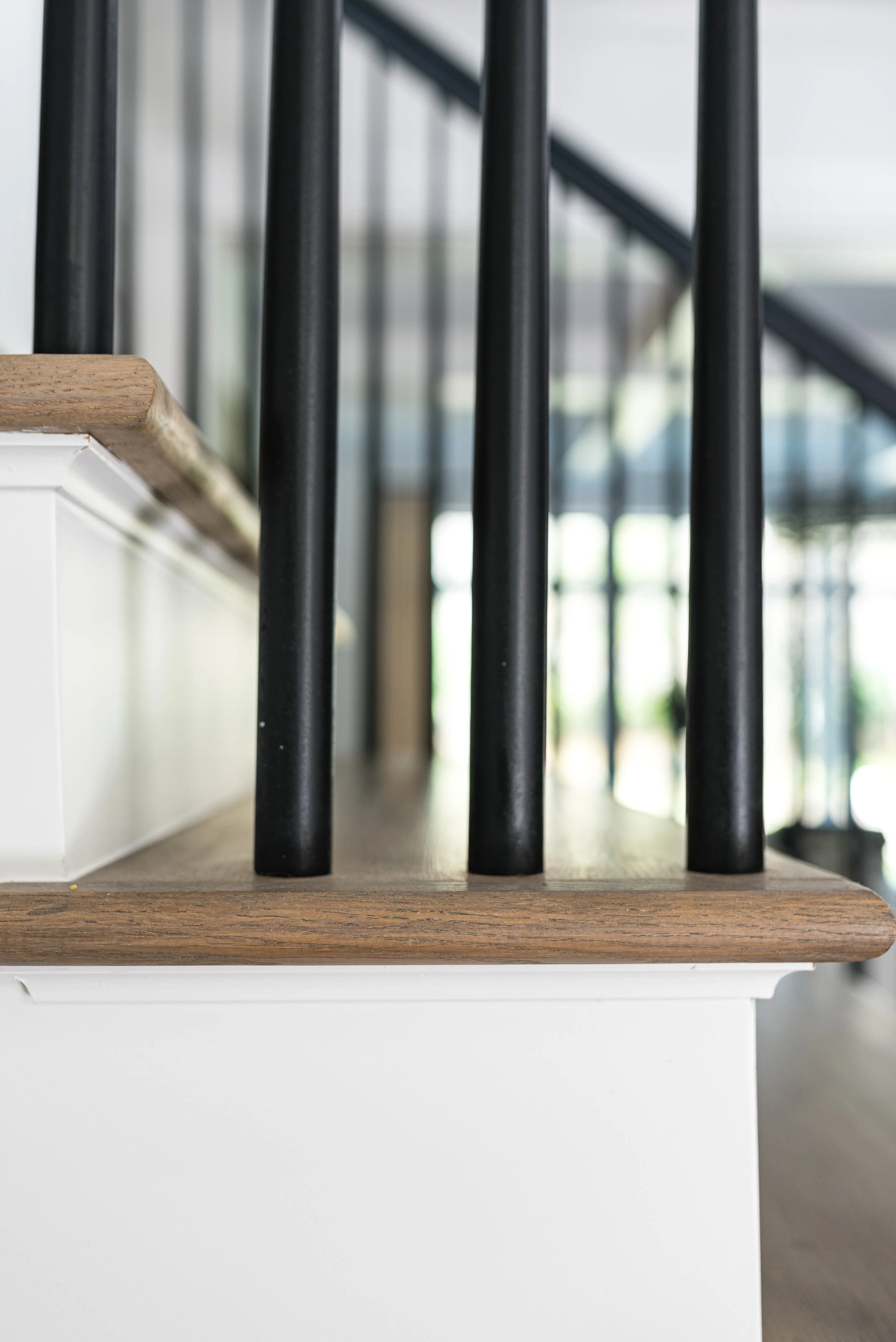 close up of stained staircase to match wood floors