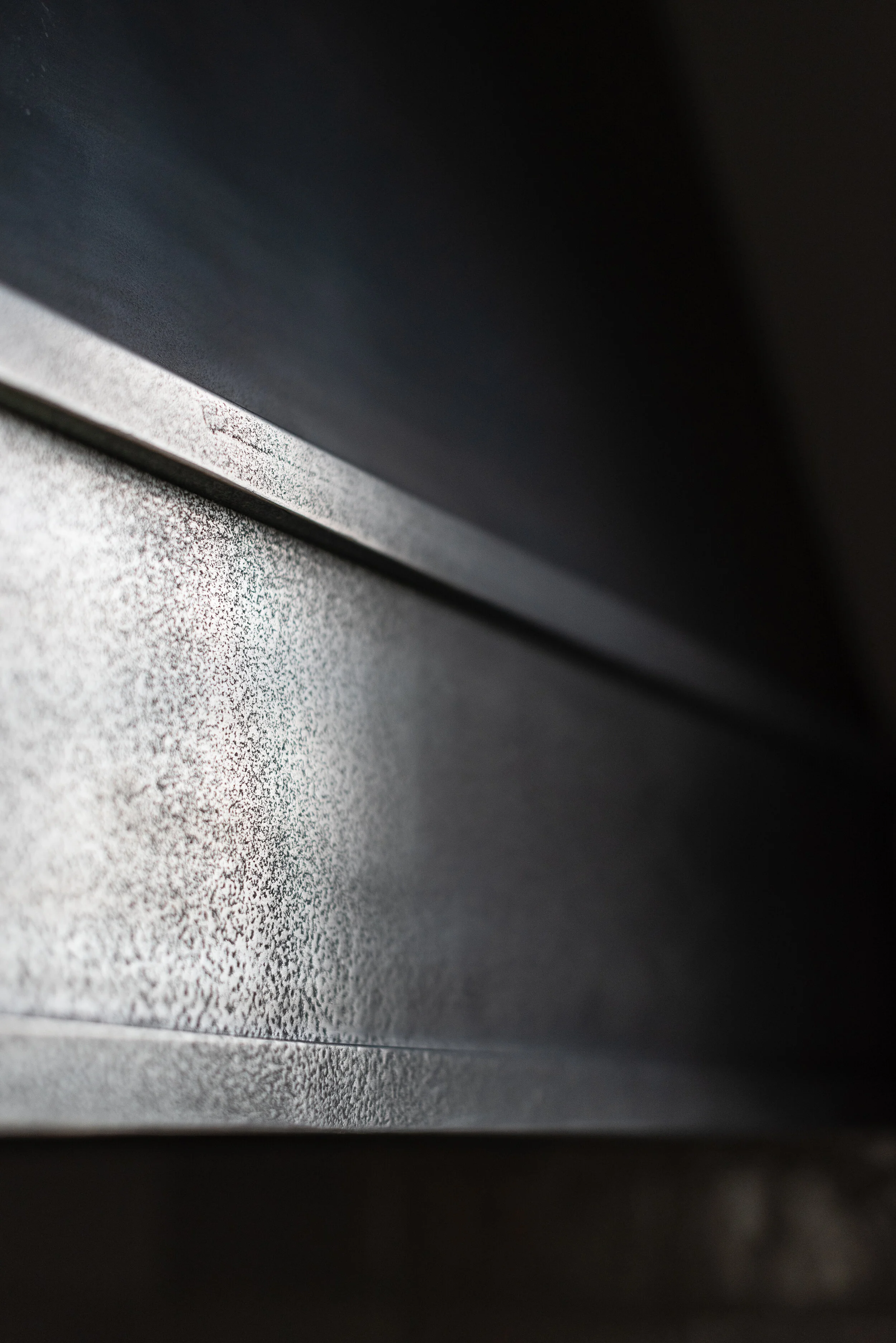 side view of liquid metal range hood