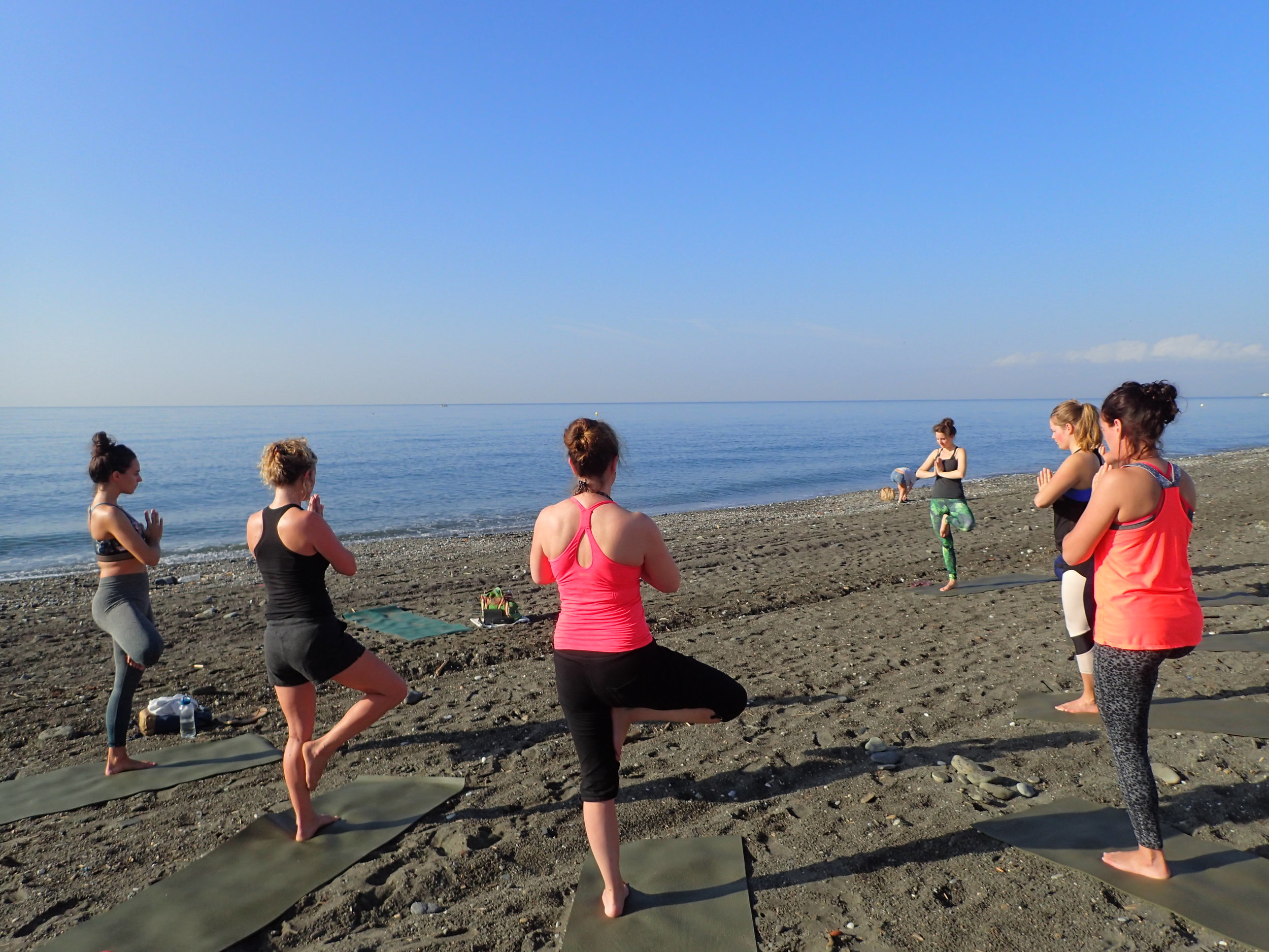 Yoga practice with Jane Bakx on beach Malaga Spain Yin Yang Yoga retreat 