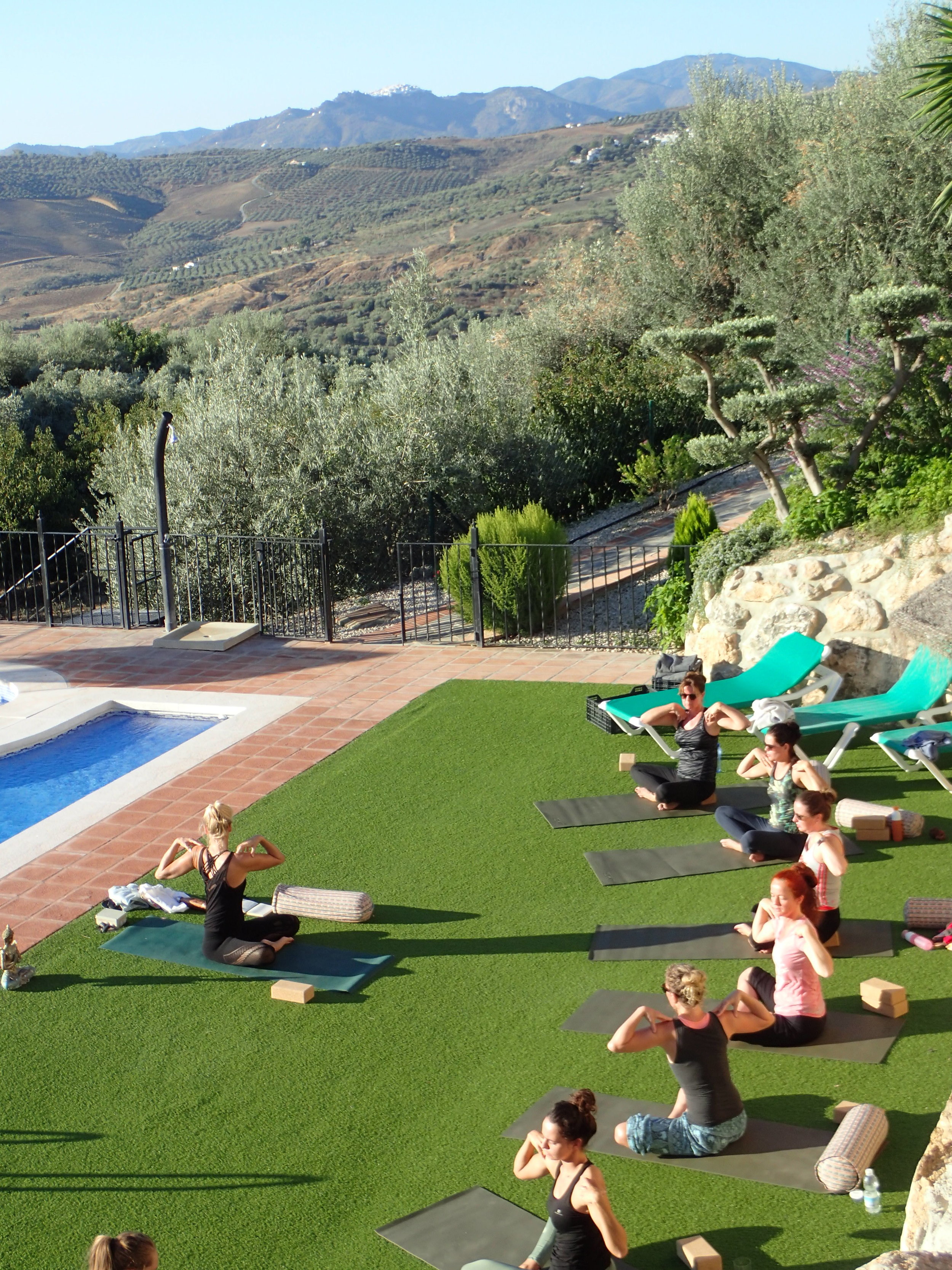 Yoga practice at pool Yin Yang yoga retreat Malaga Spain with Jane Bakx 