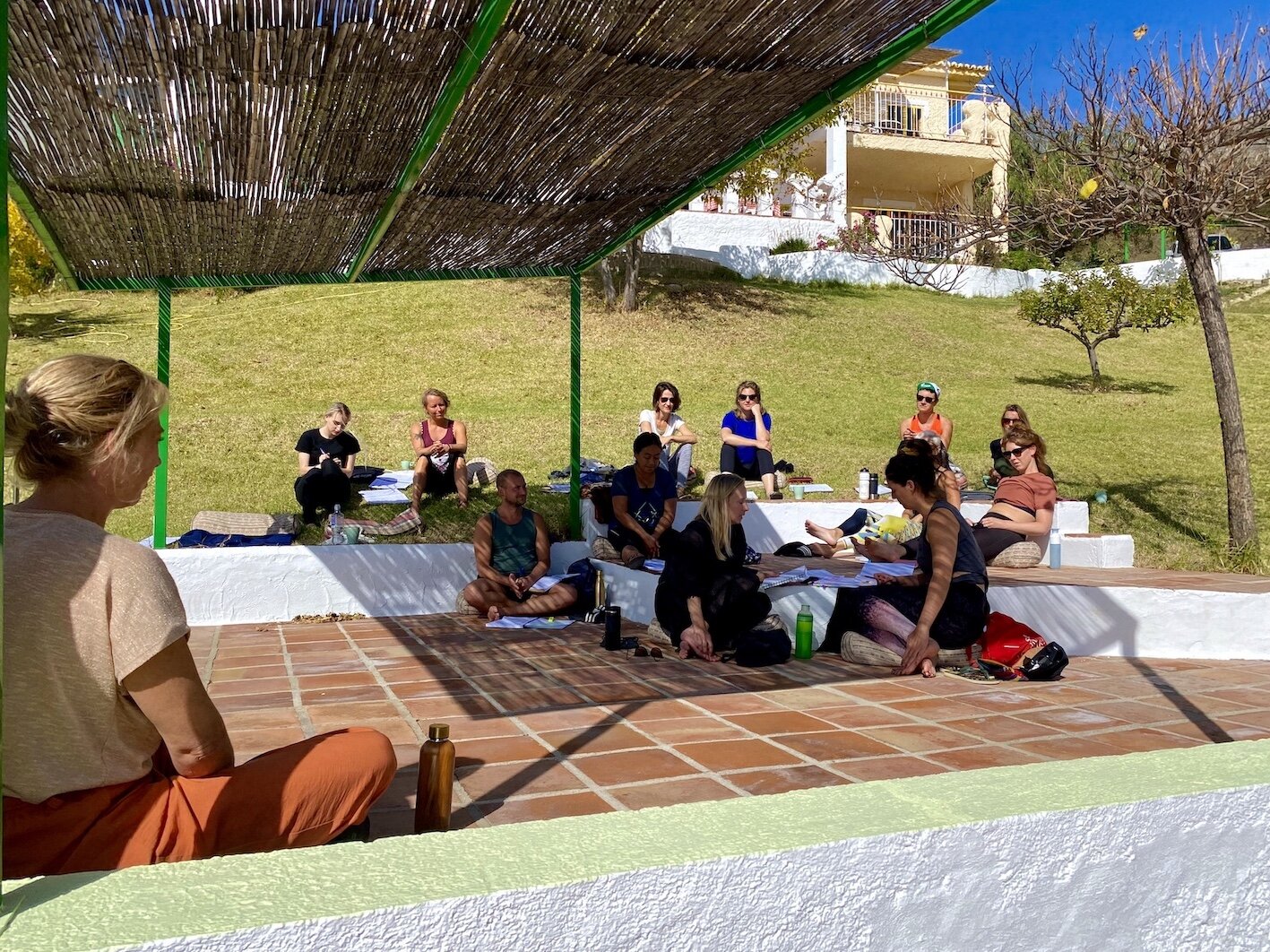 Lectures outside in garden 200h Yin Vinyasa Teacher training course Spain Jane Bakx Yoga