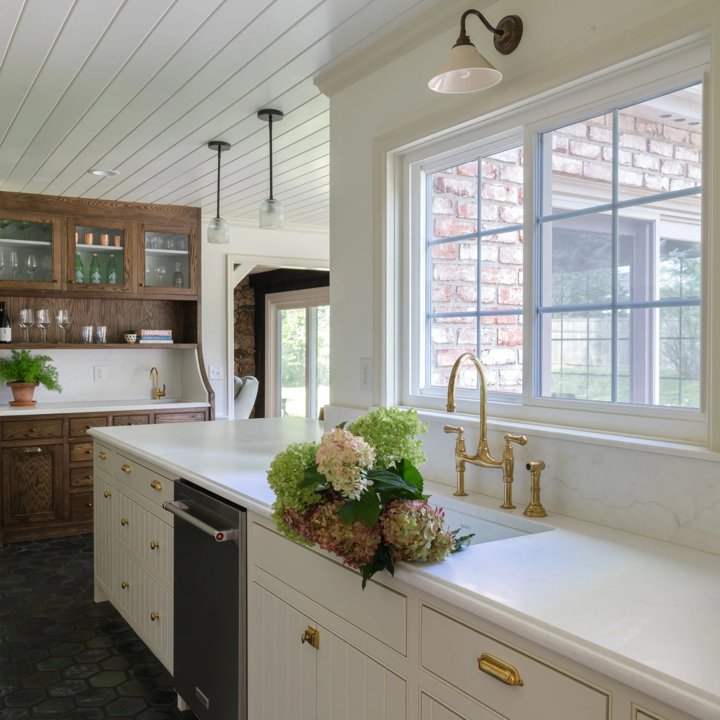 Luxury kitchen renovation with custom cabinetry and aged brass accents