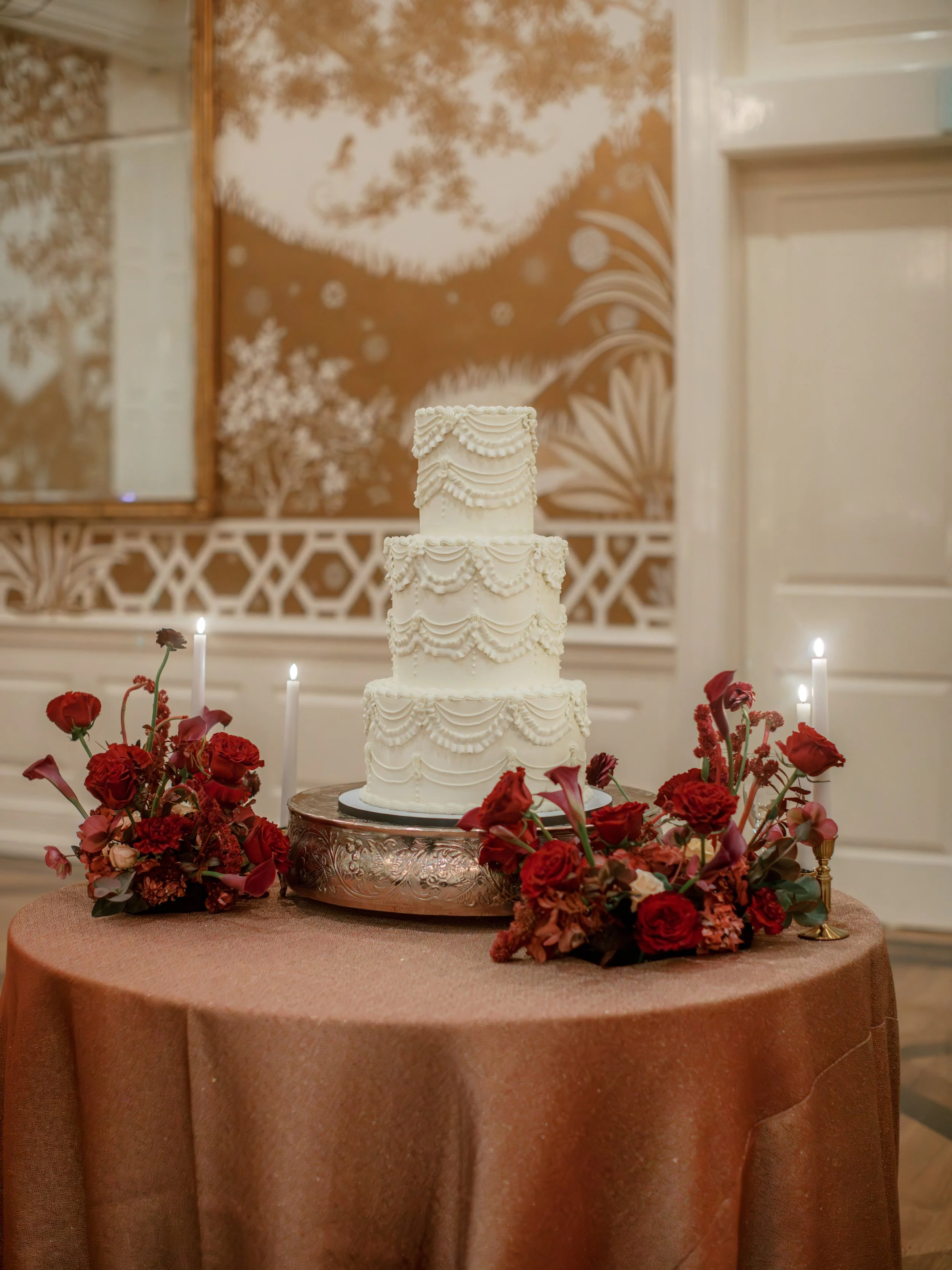 Wedding cake floral meadow at Junior League of Houston wedding reception. 