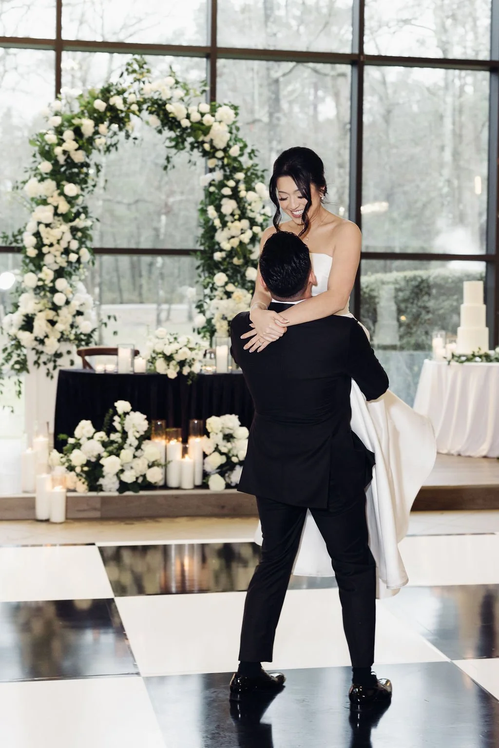 Houston luxury wedding florist designing sophisticated floral arrangements at Luminaire venue with timeless romantic styling.
