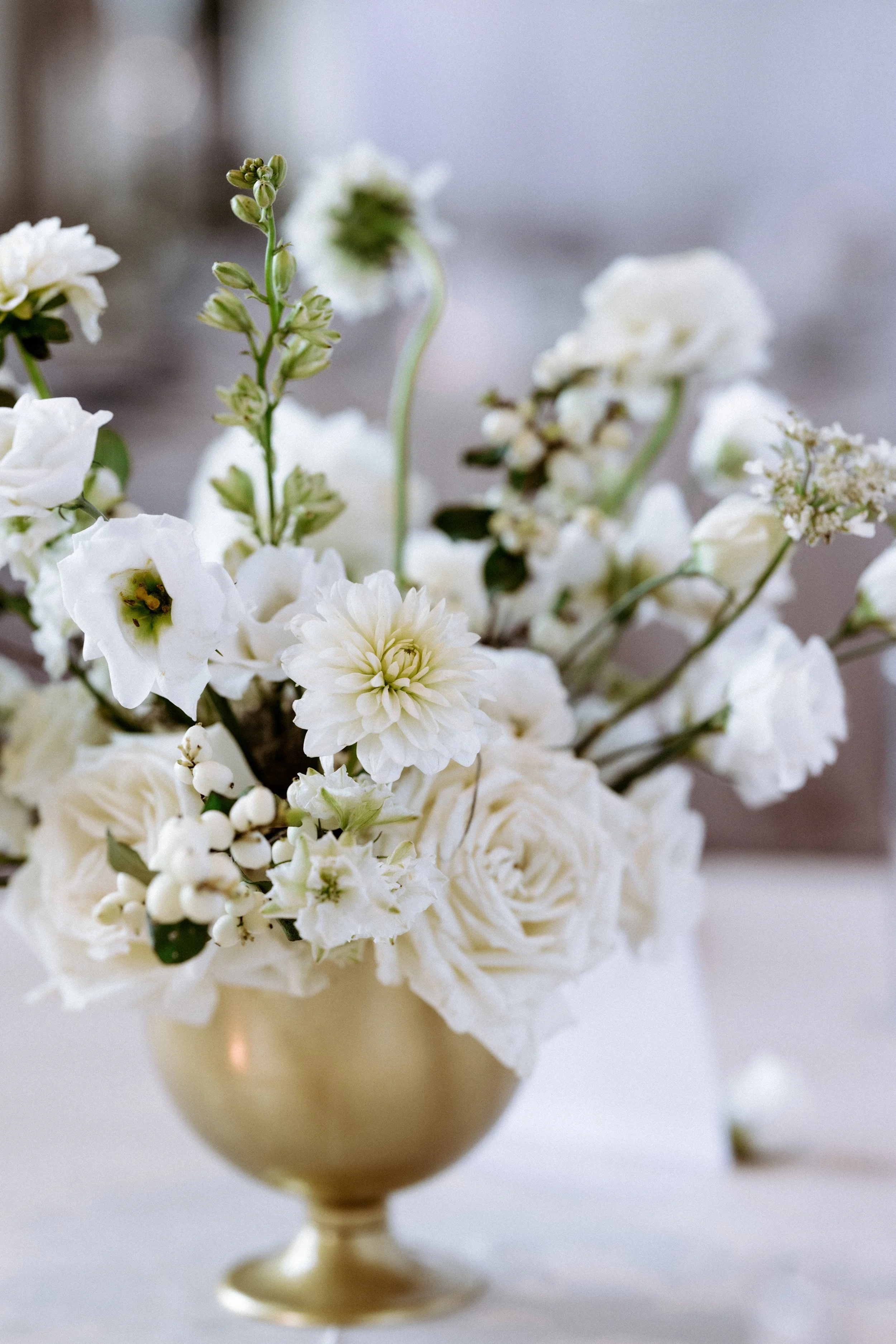Modern low floral centerpieces at The Corinthian Houston luxury wedding reception tables.