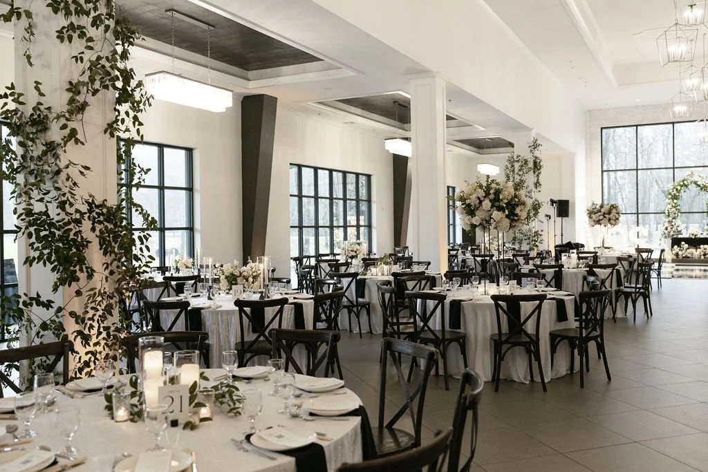 Houston luxury wedding florist designing sophisticated floral arrangements at Luminaire venue with timeless romantic styling.