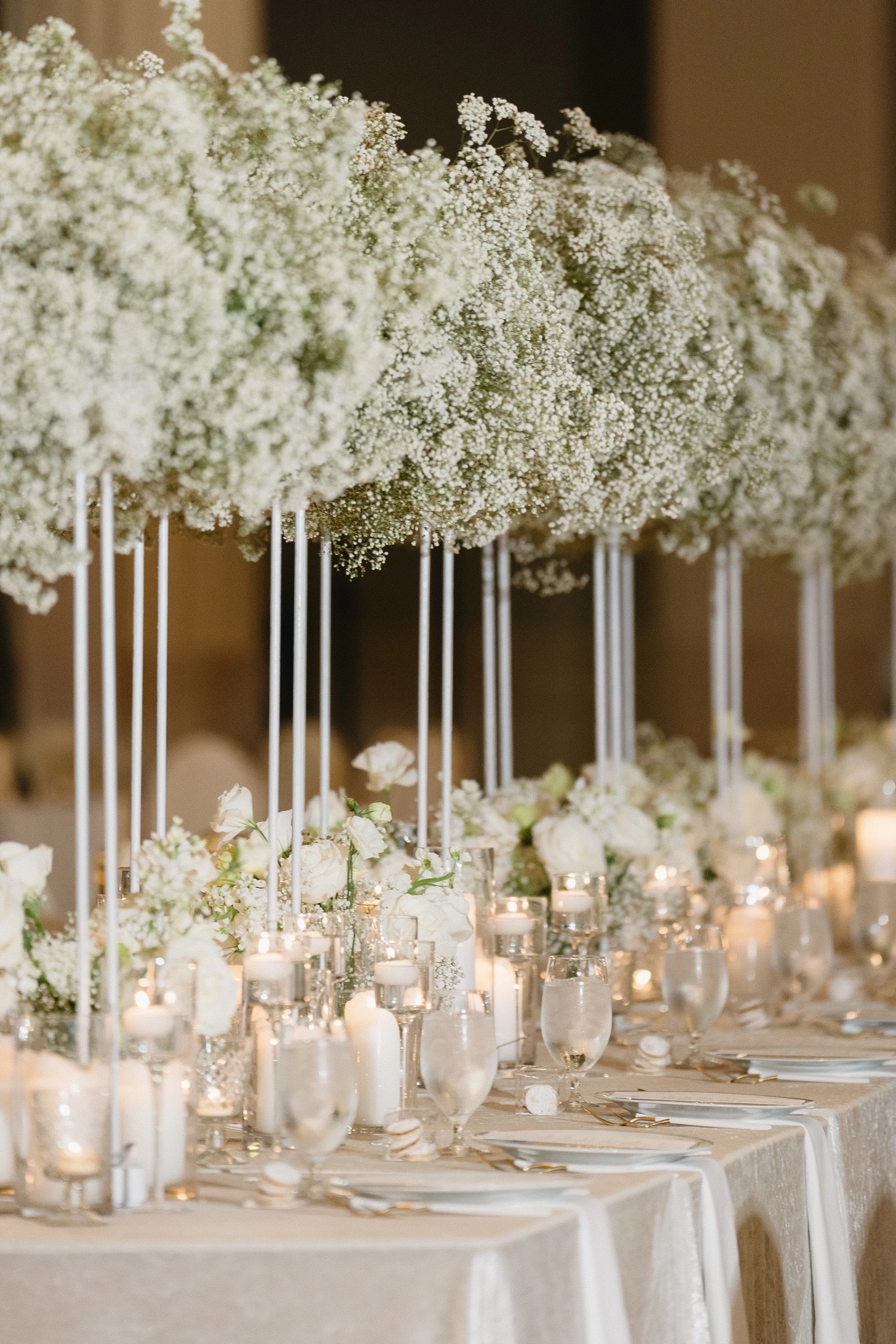 Lush baby's breath head table floral installation at The Corinthian Houston wedding reception