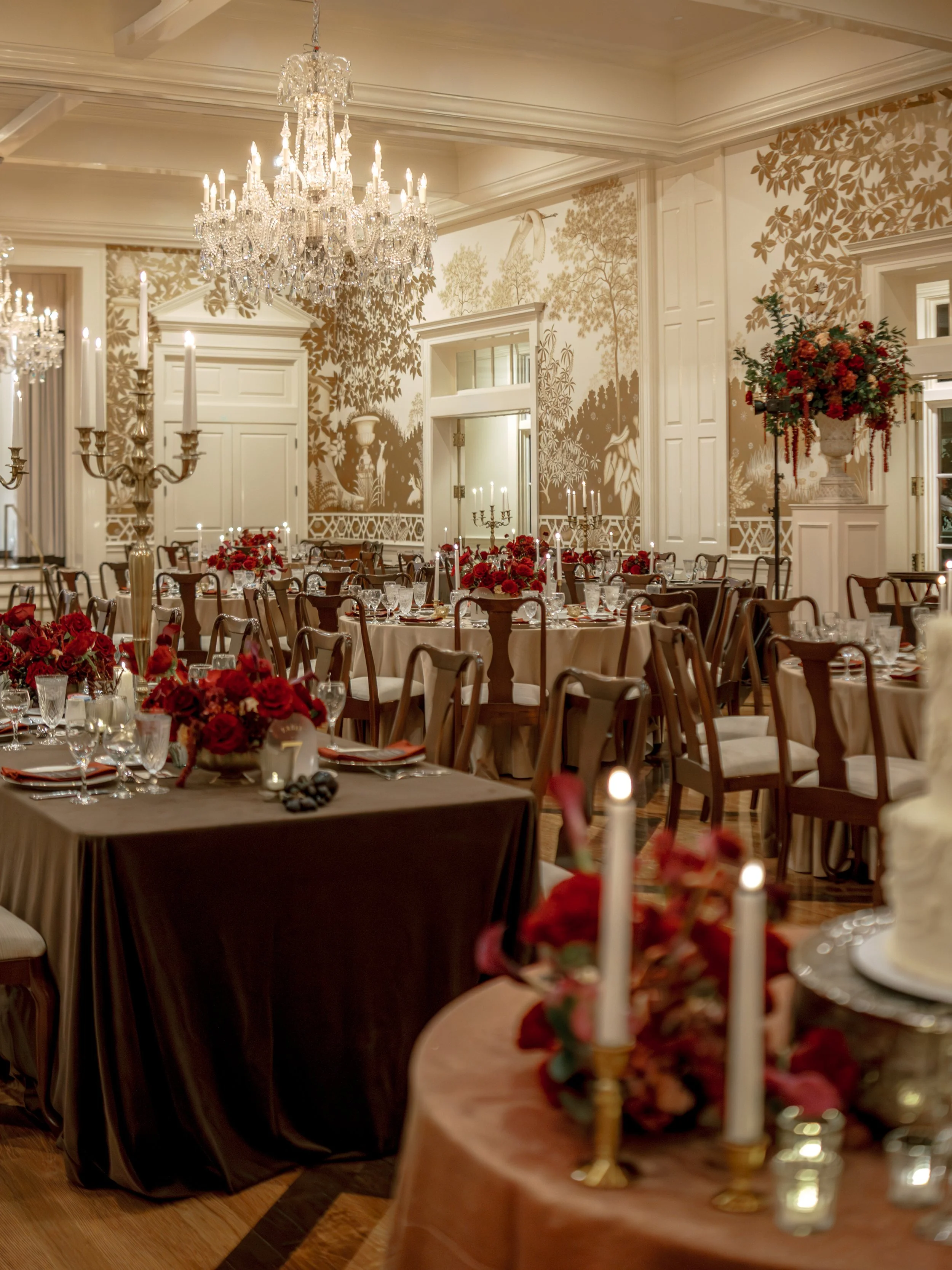 Luxury red rose wedding reception with low floral centerpieces at Junior League of Houston.