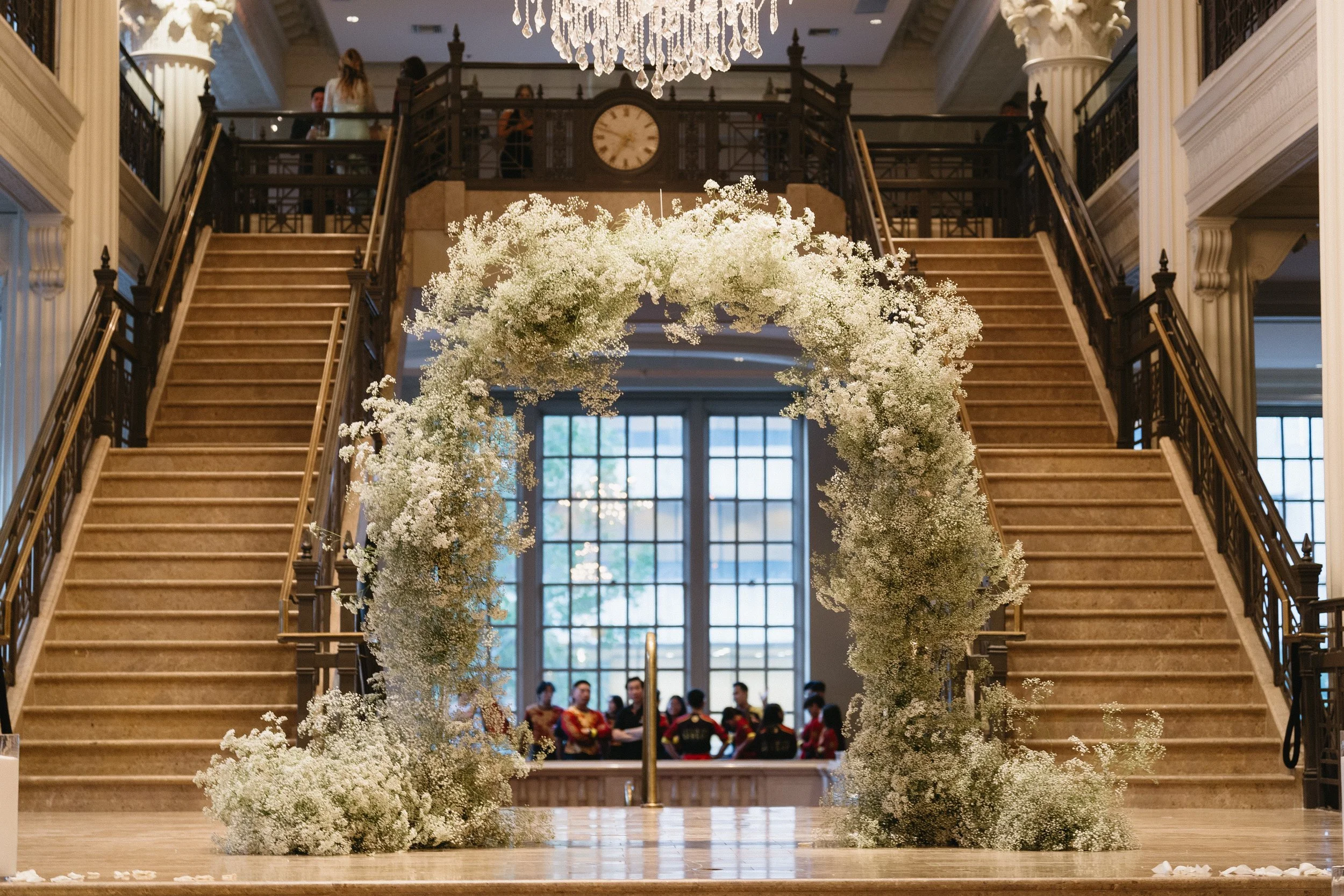Baby's breath floral arch at The Corinthian Houston luxury wedding ceremony
