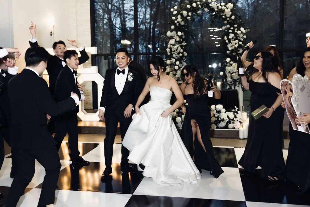 Houston luxury wedding florist designing sophisticated floral arrangements at Luminaire venue with timeless romantic styling.
