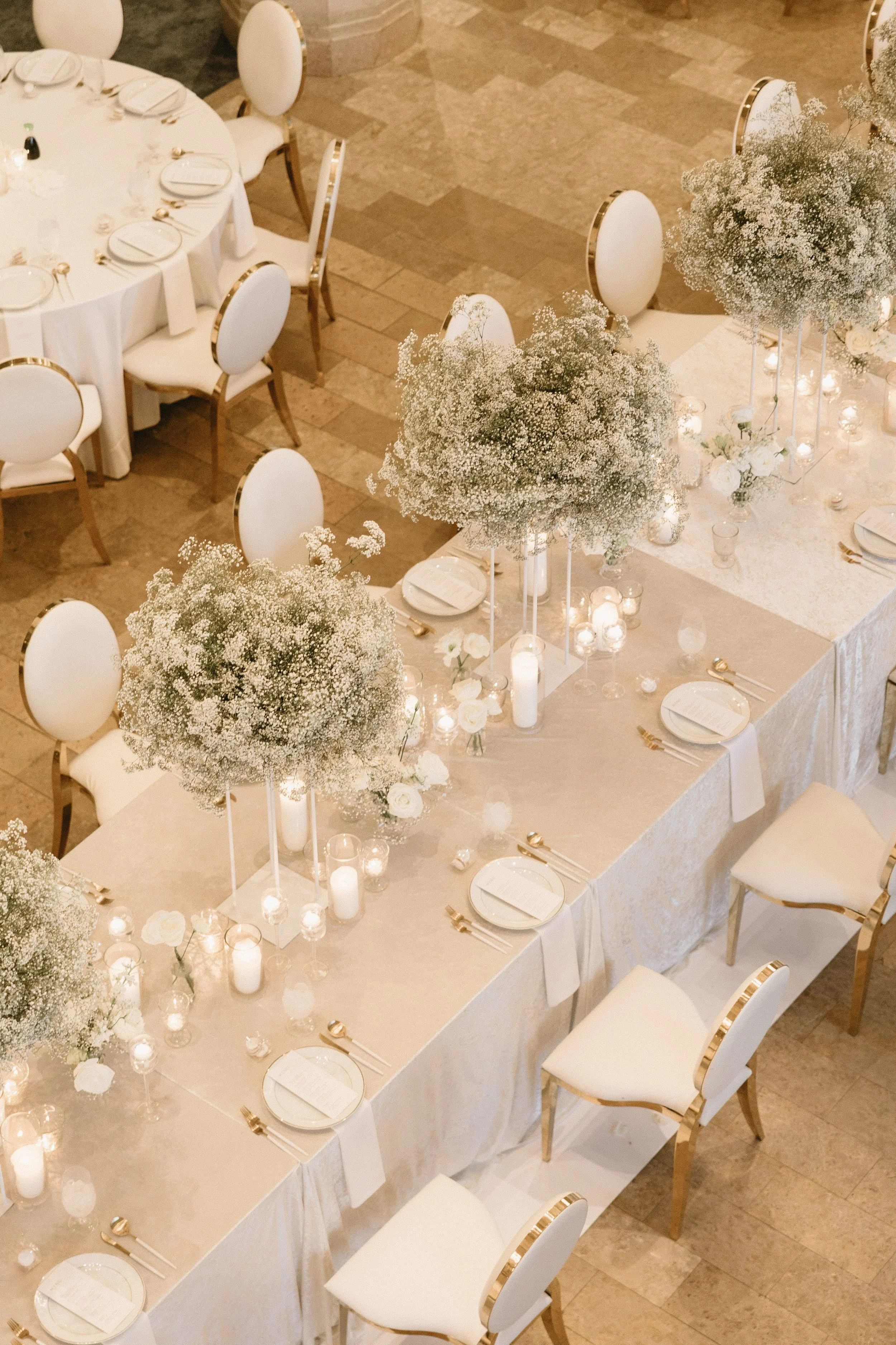 Lush baby's breath head table floral installation at The Corinthian Houston wedding reception