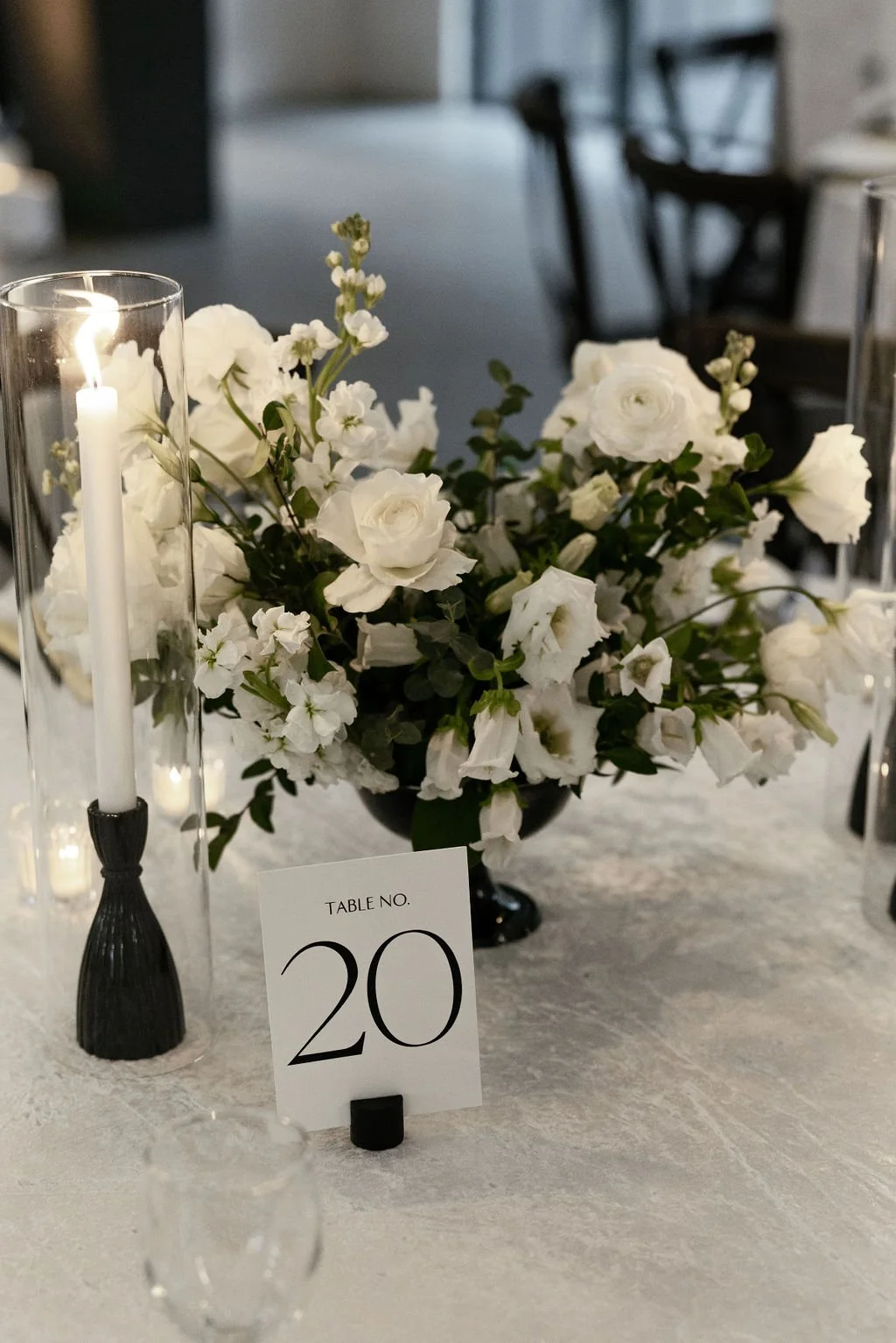 Houston luxury wedding florist designing sophisticated floral arrangements at Luminaire venue with timeless romantic styling.