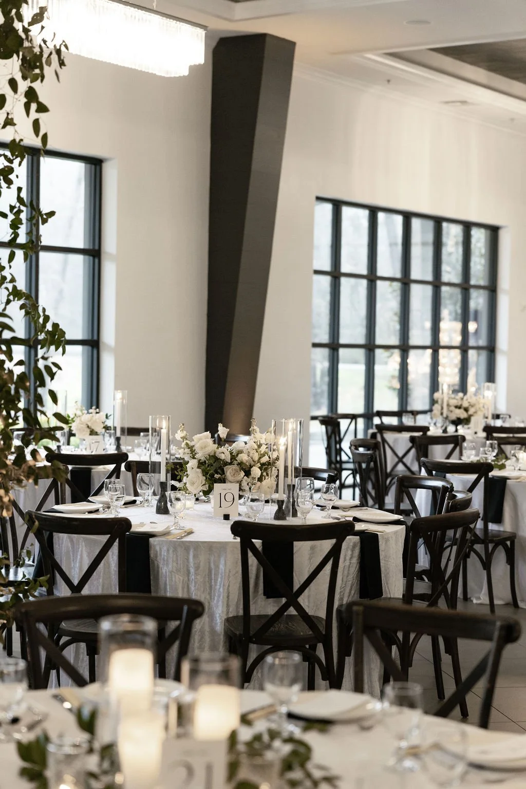 Houston luxury wedding florist designing sophisticated floral arrangements at Luminaire venue with timeless romantic styling.