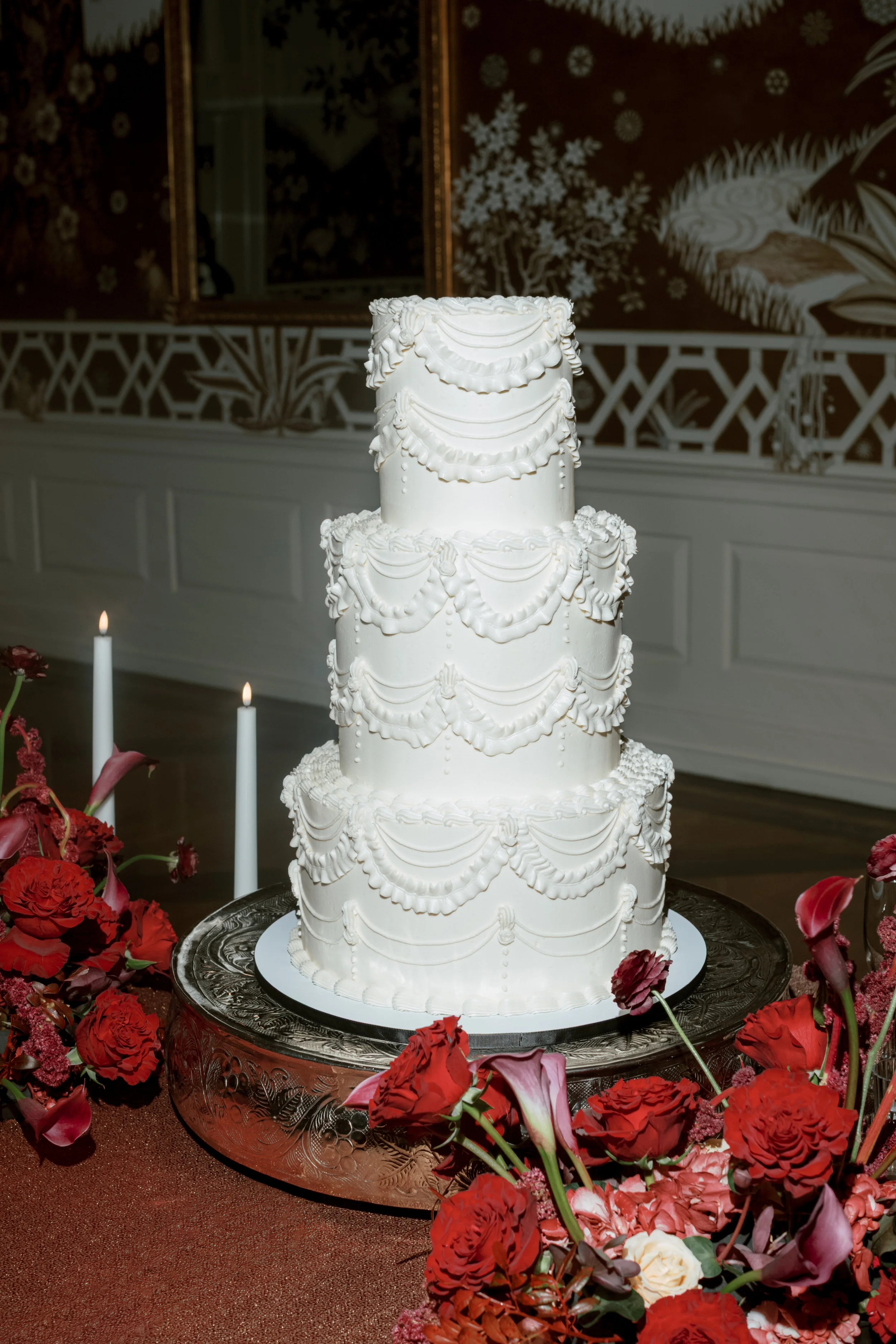 Wedding cake floral meadow at Junior League of Houston wedding reception. 