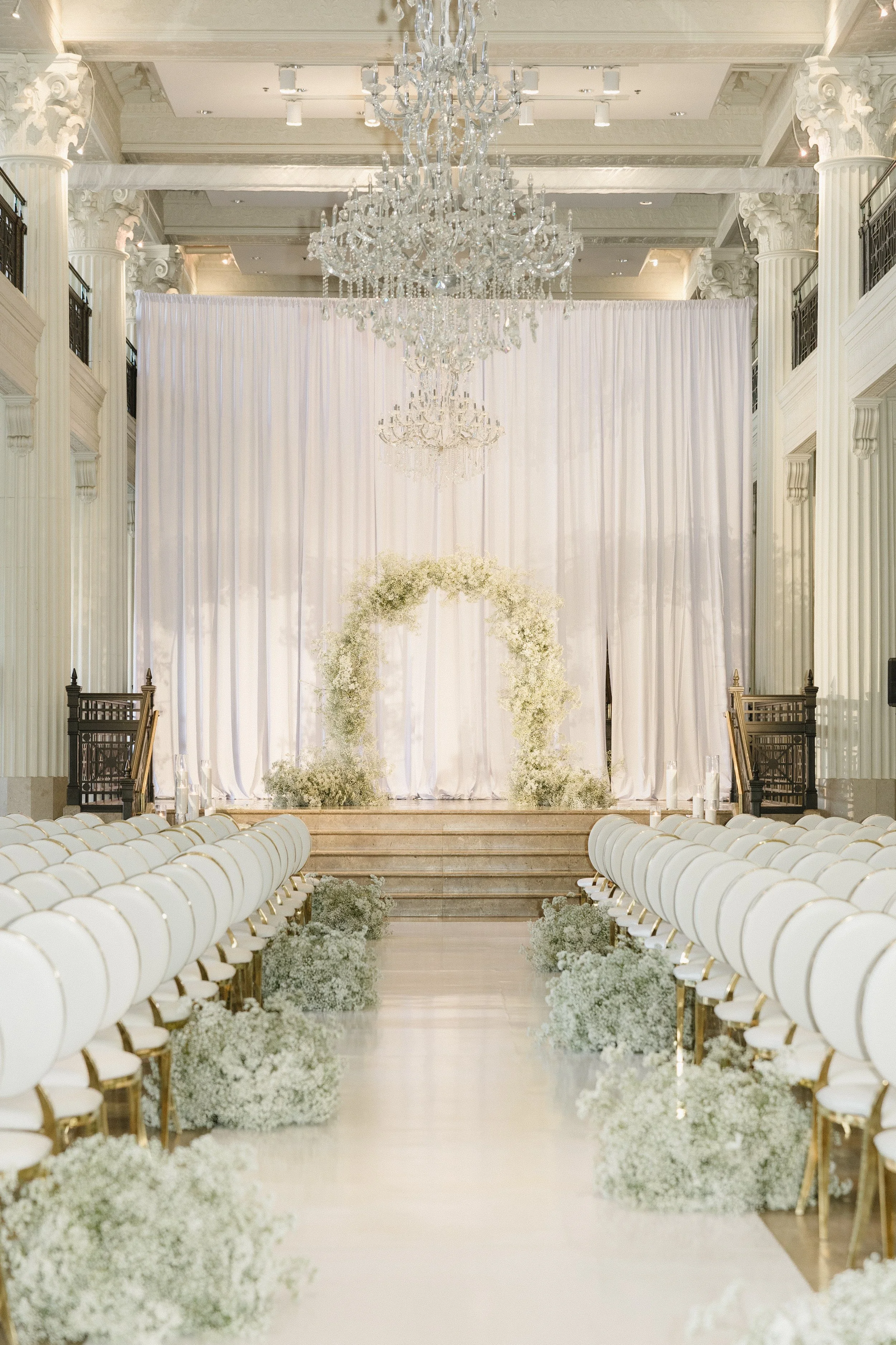 Lush baby's breath ceremony installation at The Corinthian Houston wedding