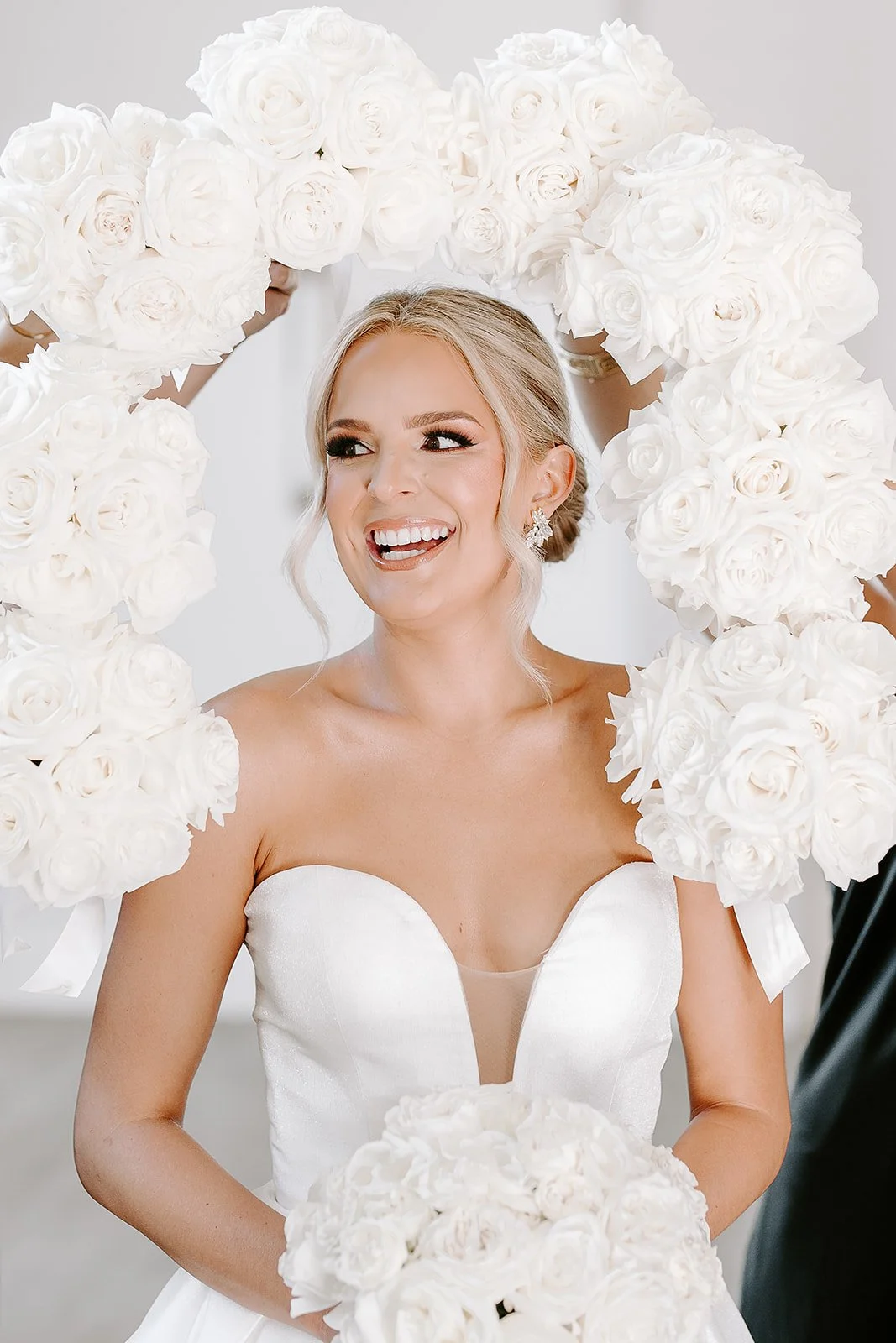 Houston luxury wedding florist designing sophisticated floral arrangements at Luminaire venue with timeless romantic styling.