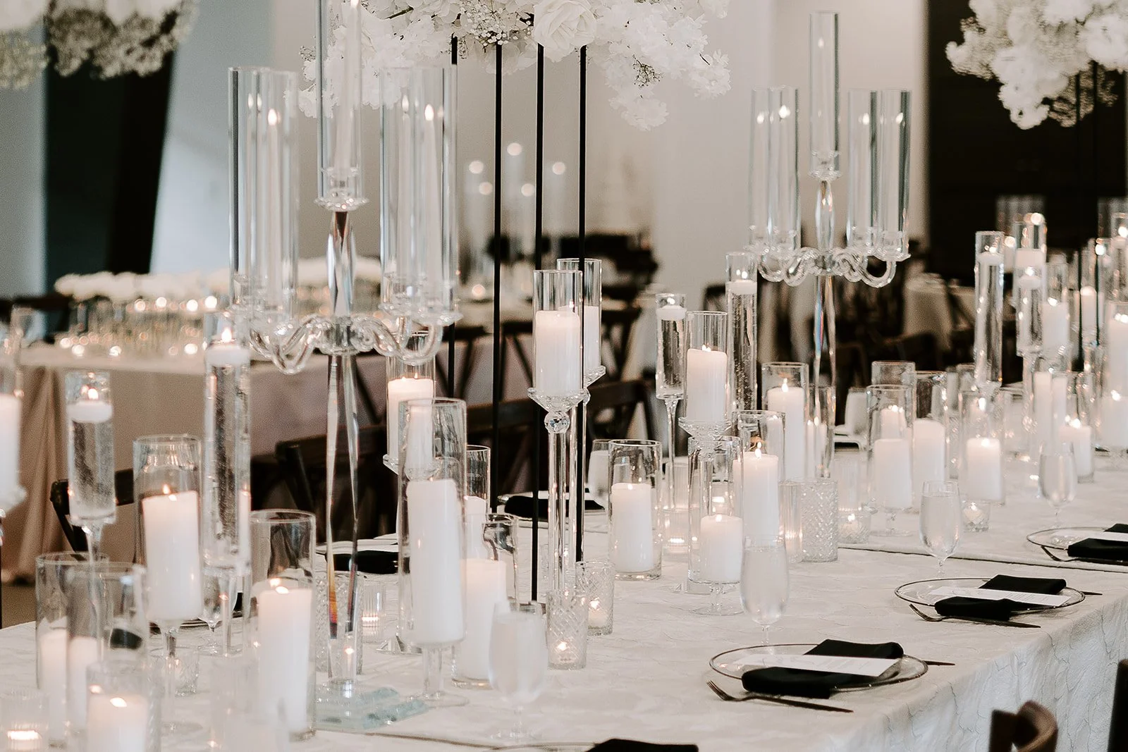 Houston luxury wedding florist designing sophisticated floral arrangements at Luminaire venue with timeless romantic styling.