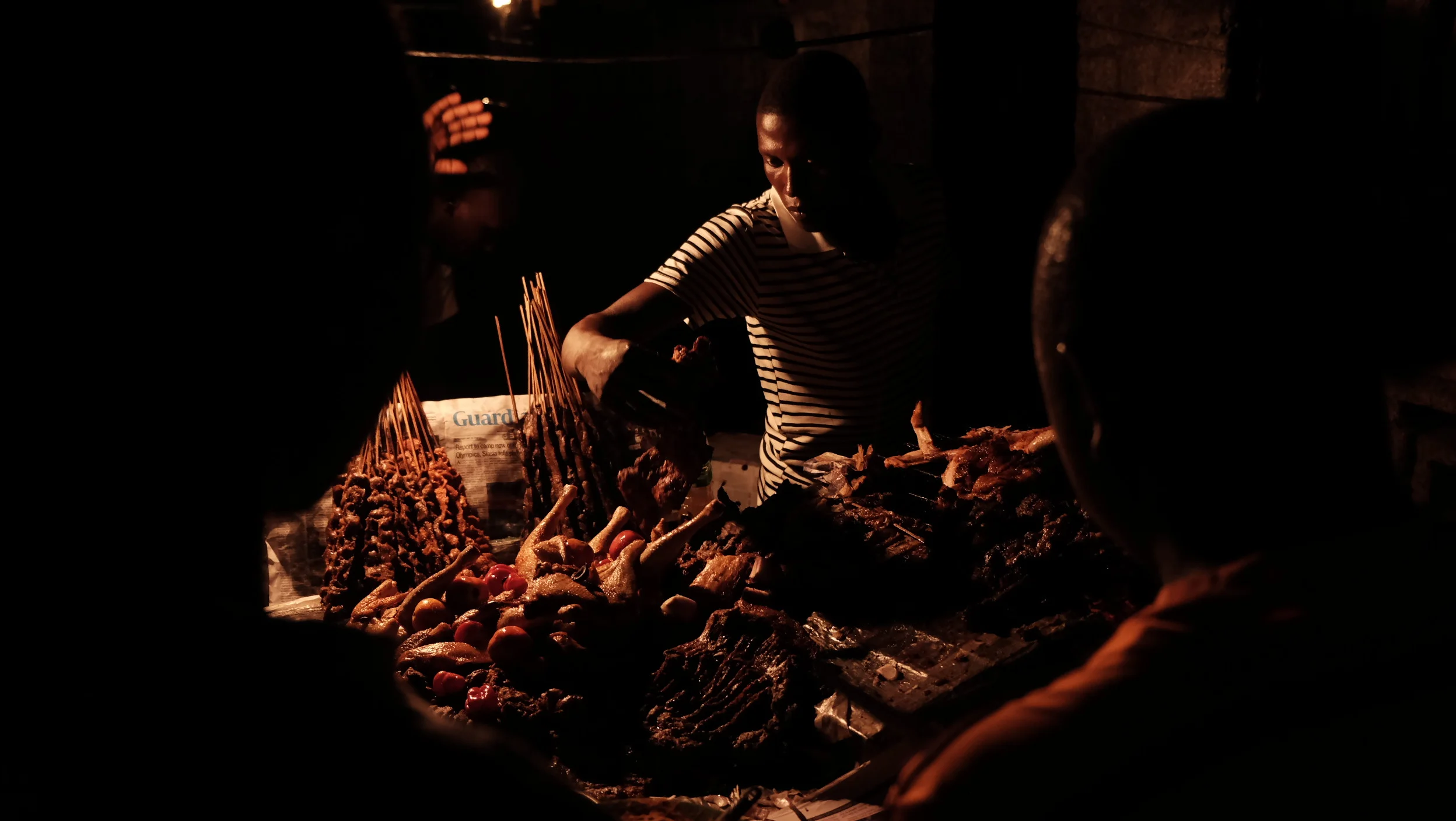  A suya seller grills meat for his customers. Lagos, Nigeria. ©2017 