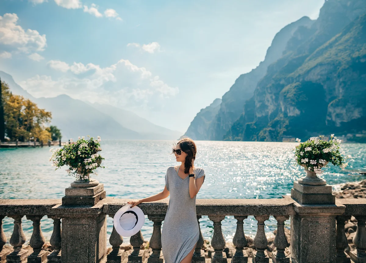 Copy of Young beautiful woman relaxing on picturesque Garda Lake