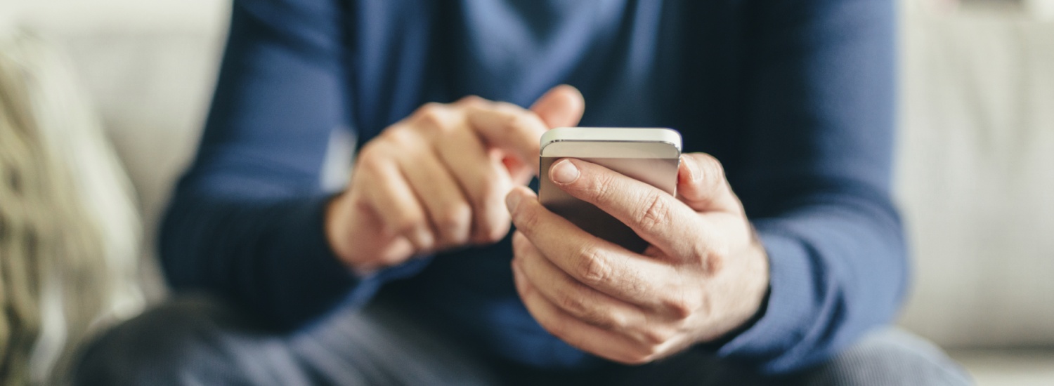 Connect-With-Us-Landing-Man-Typing-Smartphone.jpg