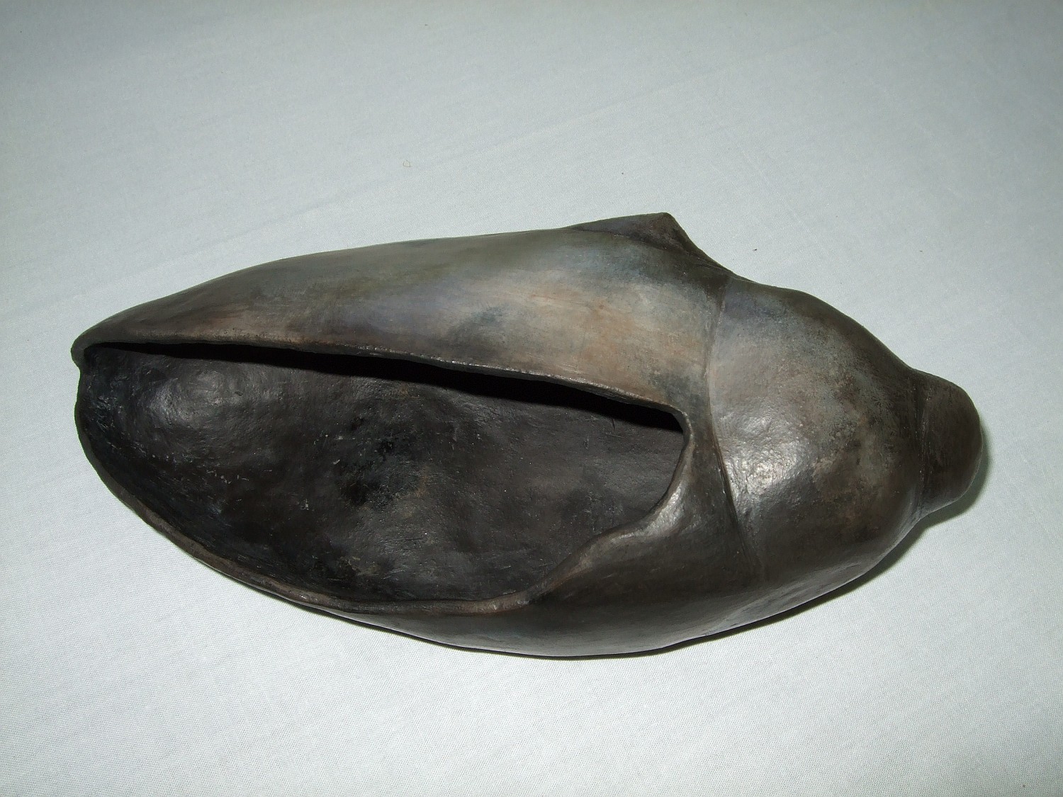 Sawdust fired beetle cremation vessel