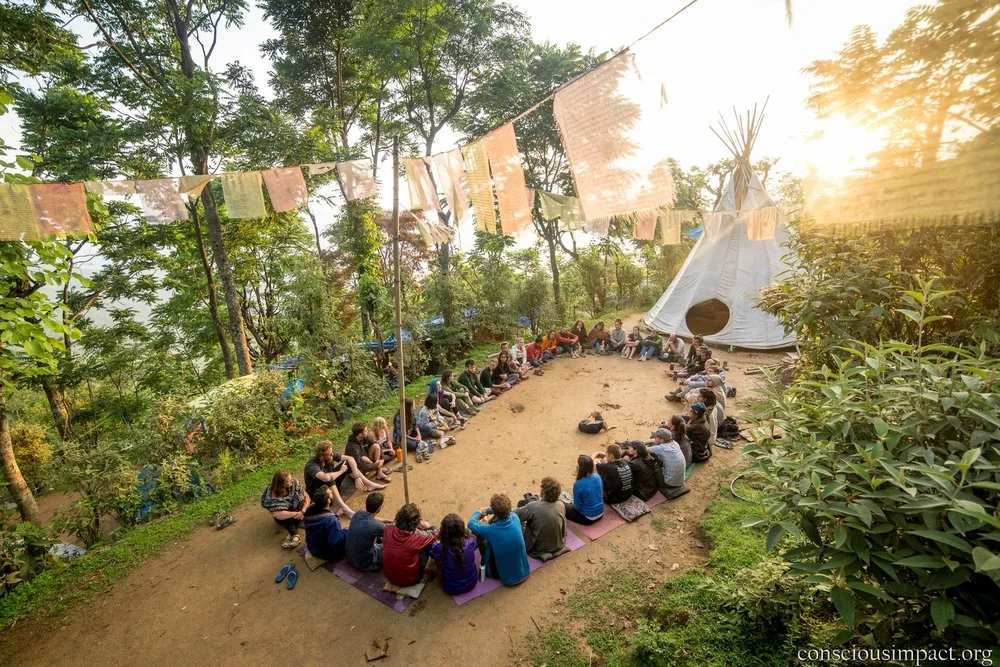 Conscious Impact volunteers gather to share gratitude at our camp in Takure.