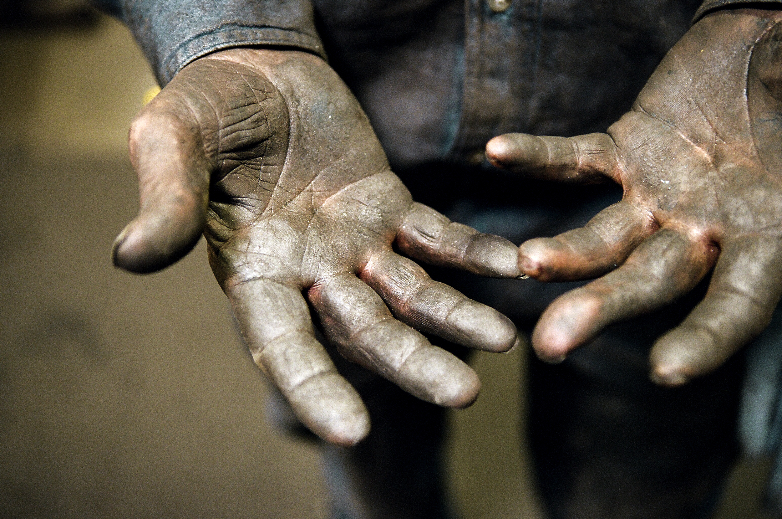 Dirty hands at a hanger factory.