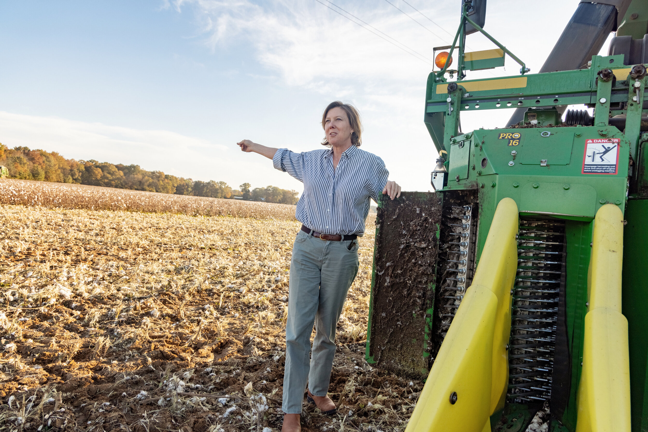 Larkin Martin in a cotton field with a cotton combine. 