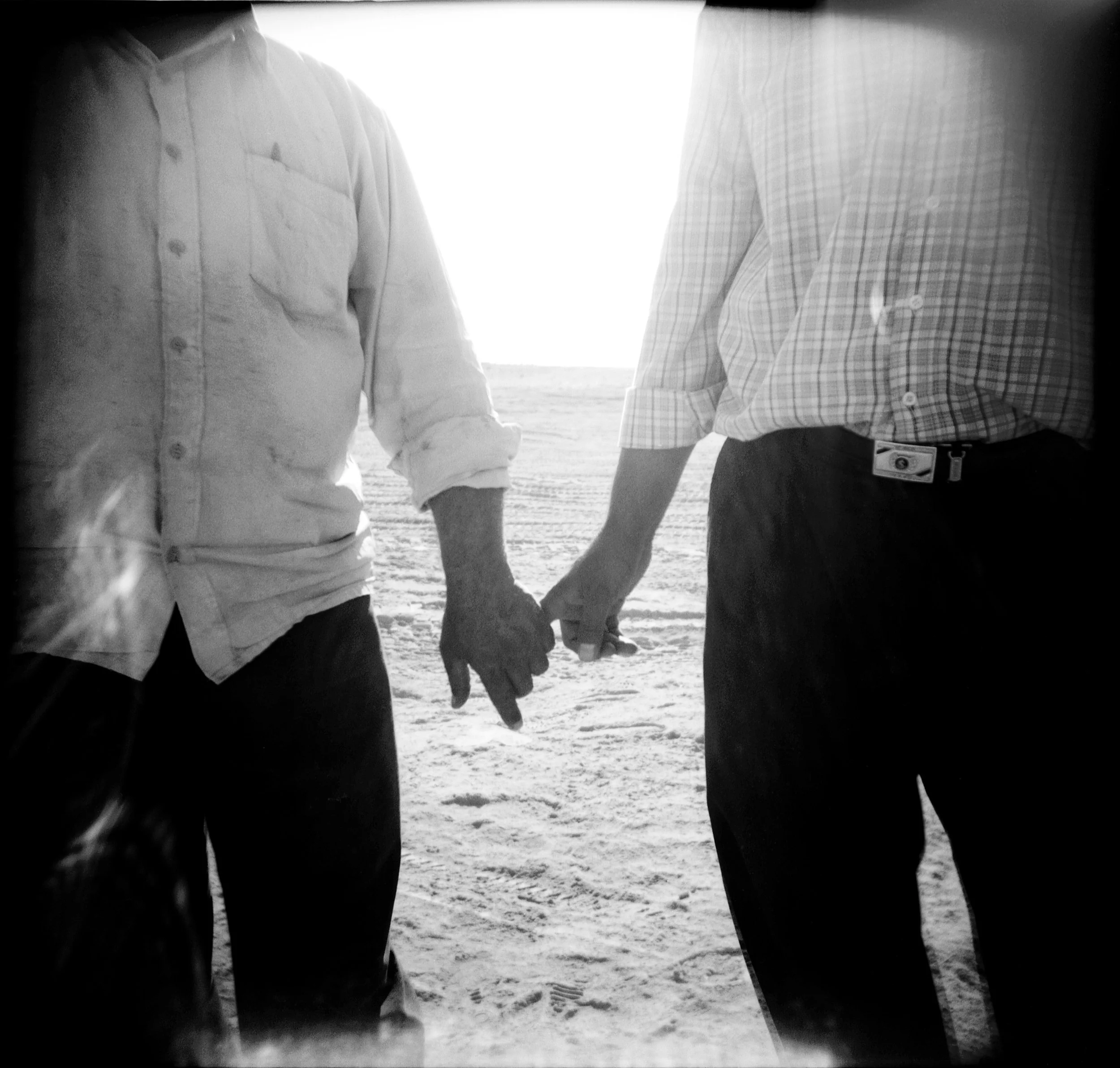 025_qwest hand holding.jpg