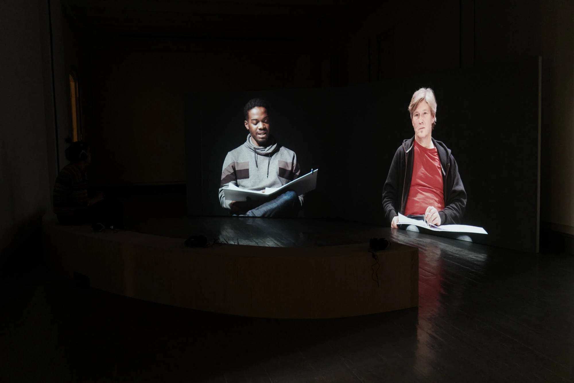   Reading out loud (2021)   Two channel video installation by Juliane Zelwies. Photo: Tromsø Kunstforening / Vsevolod Kovalevskij 