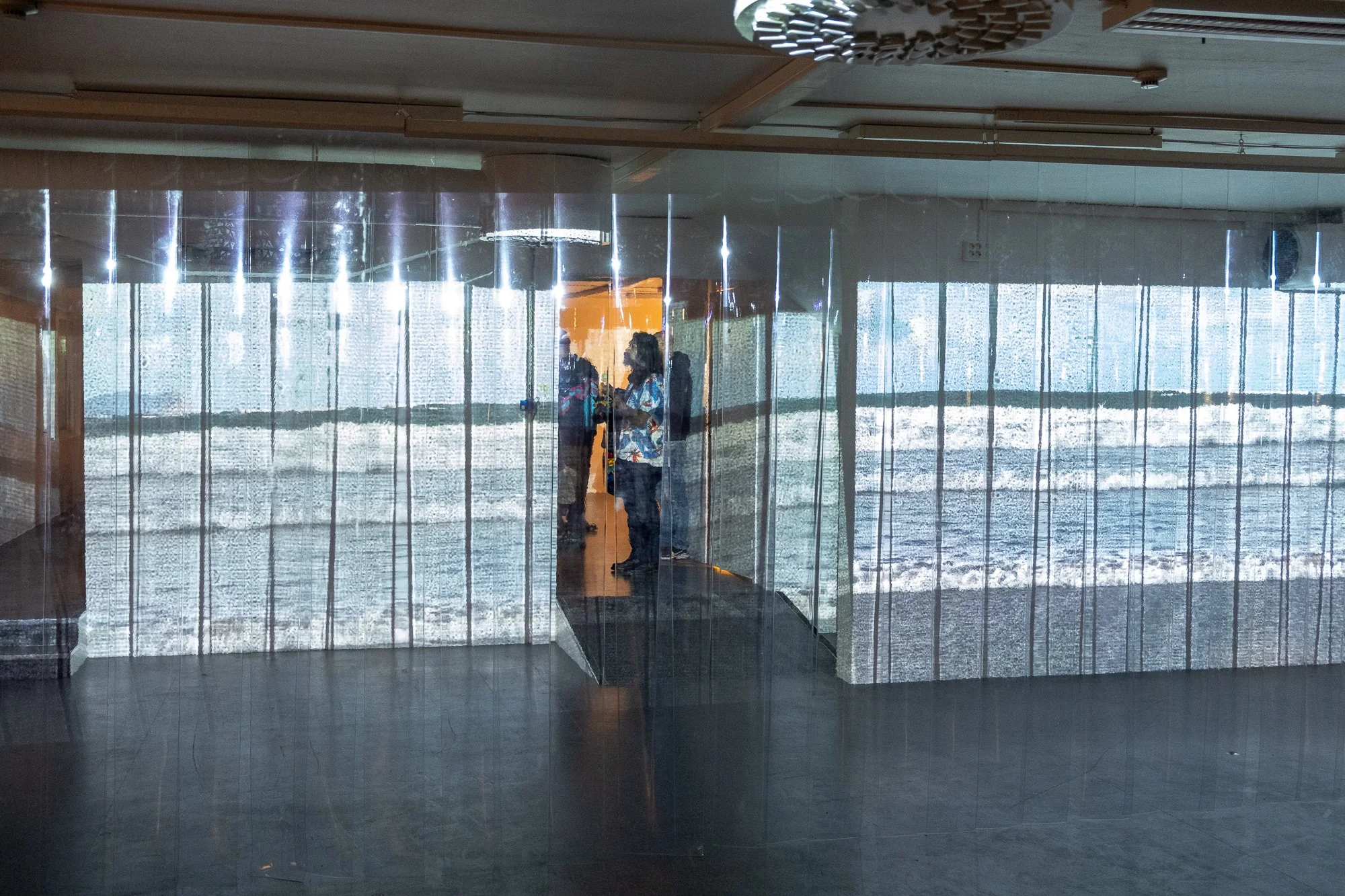   Milk  (2025) video installation with field recordings and PVC sheets. In the background one could hear the 27:44 min long sound piece  Uterine Souffle  (2025). Both works by soso brafield. Photo: Kurant 