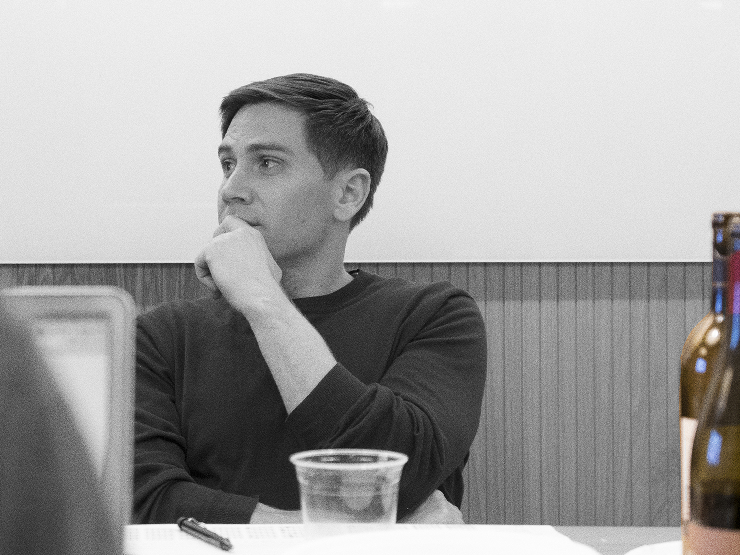 Nick Halaris, Principal/Metros Capital, listens to a discussion of artists' proposals.