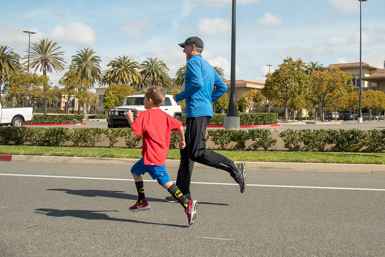 America's premier miler, Steve Scott, paces leader in a Youth Mile Race