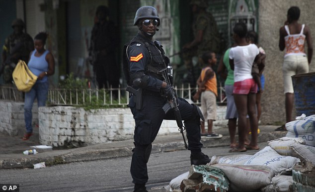 An officer at a checkpoint in Tivoli Gardens during the 2010 Tivoli Incursion. Photo Credit Daily Mail 