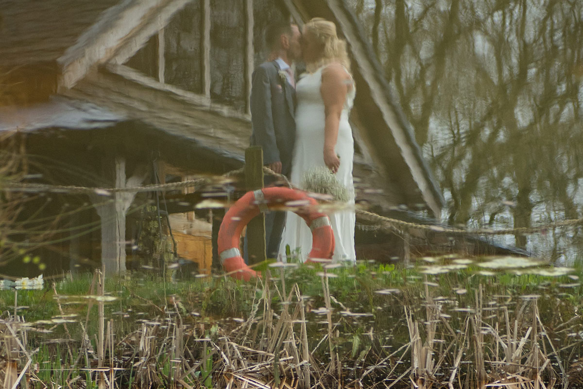 Look around and be creative. We love photographing relections whether that be in a window, mirror or a pond like this shot from a recent wedding.