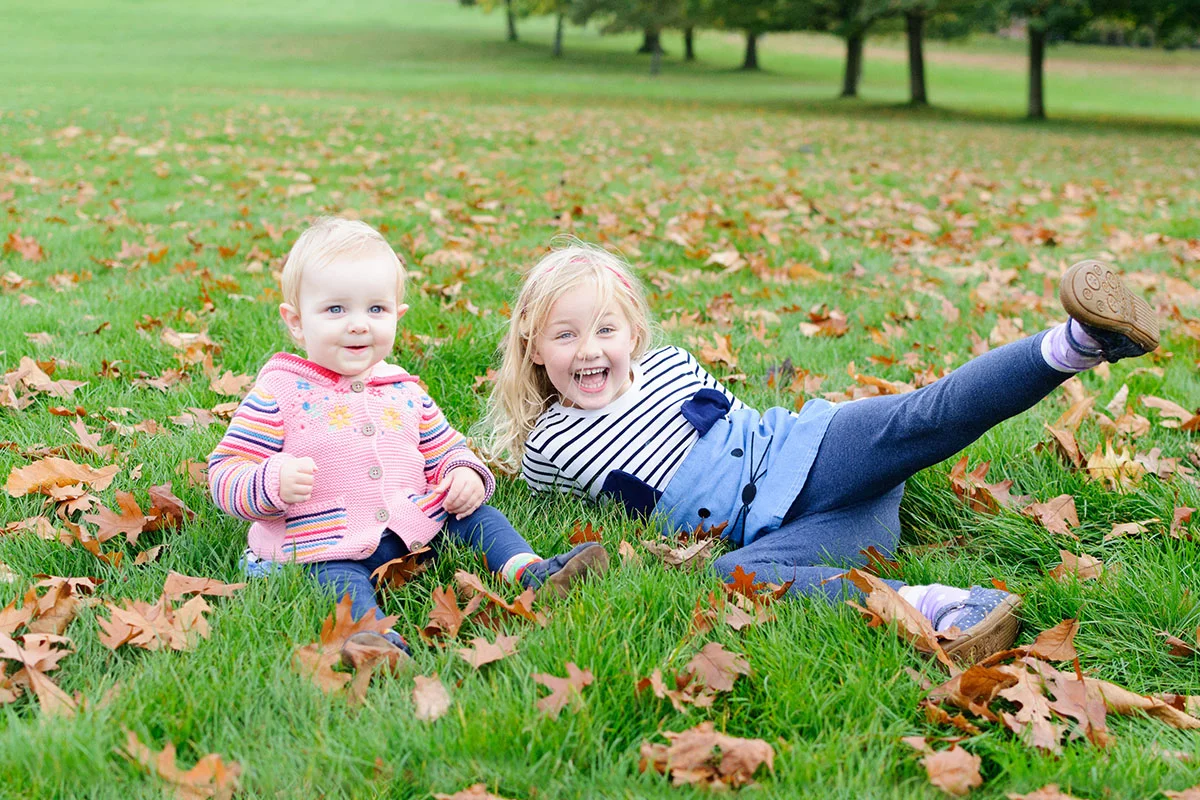 These two girls loved the autumn leaves at Wollaton Hall, Nottingham
