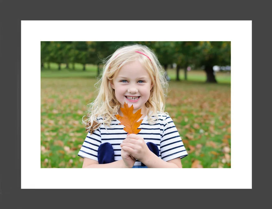 She loved playing around in the leaves and enjoyed this one in particular - we just love that natural smile and those eyes!