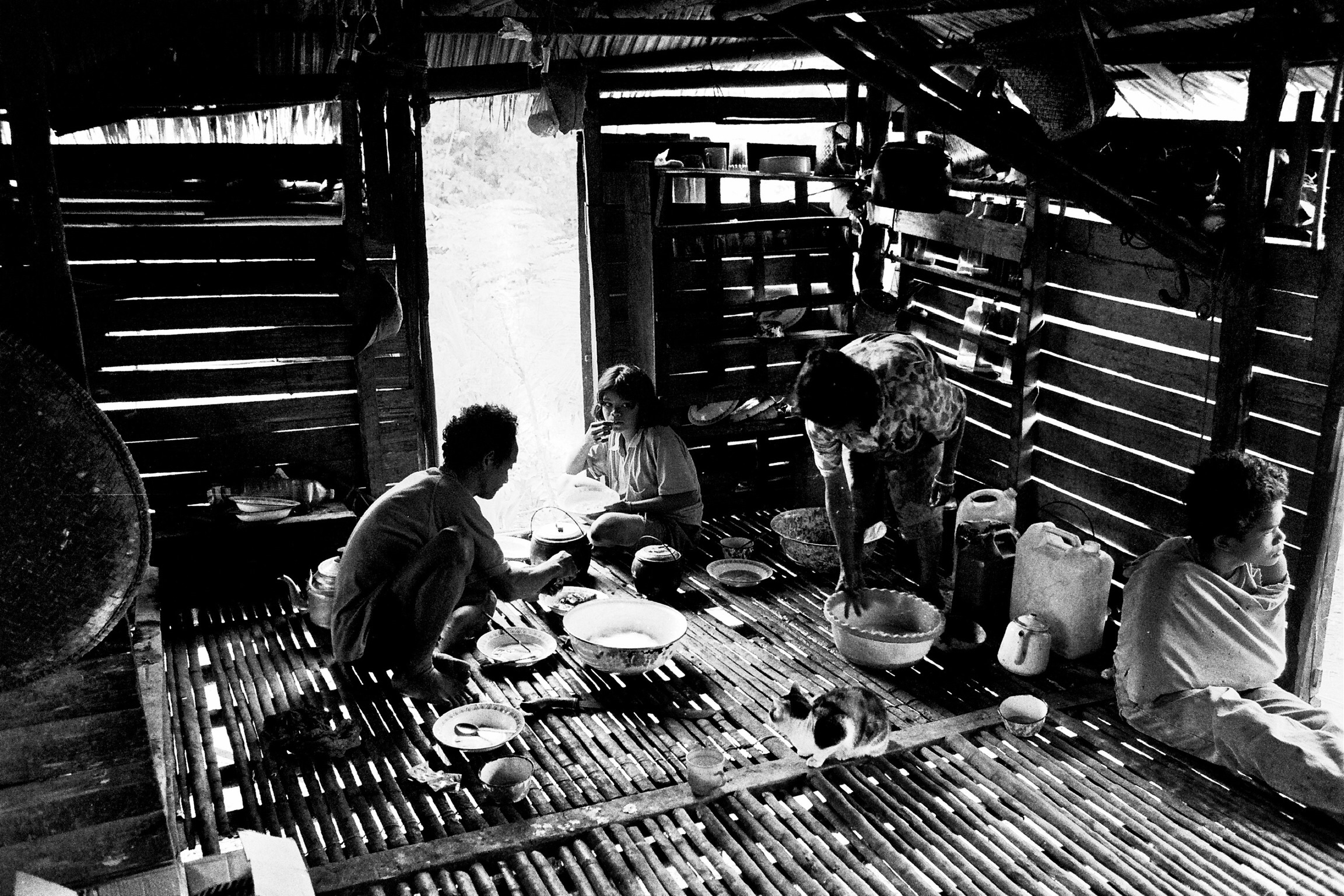 After dinner, dishes are cleared and the family sleeps in the same space.