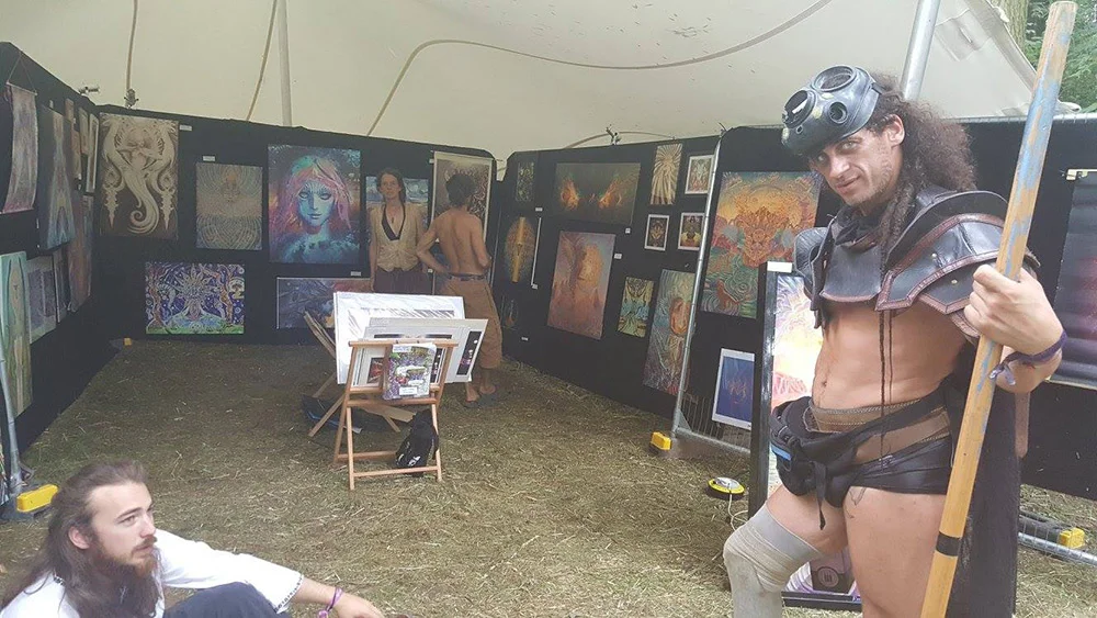 The morning after setting the gallery up. One of the performers keeping me company during a break! He was helping scare off any would-be-art-theives. Did a great job!