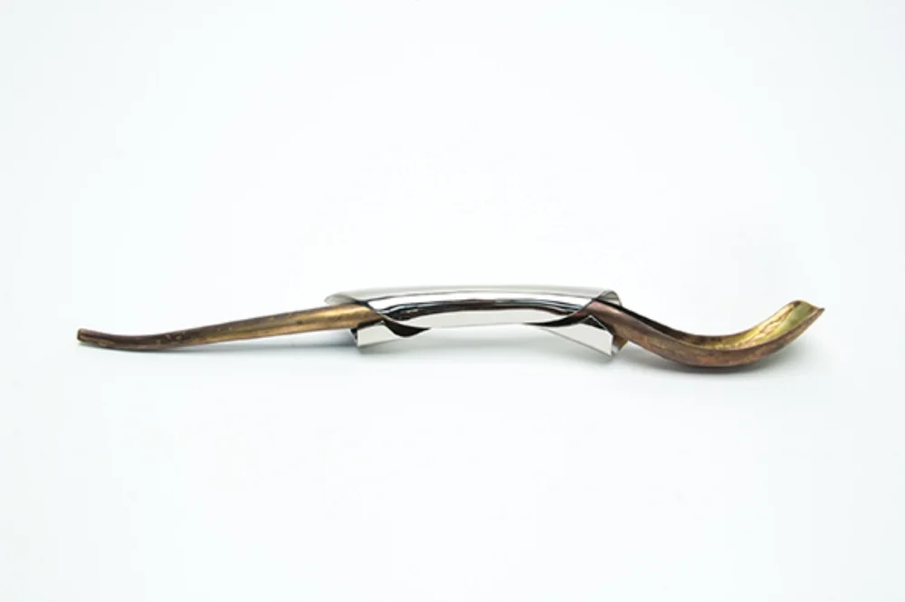   Bone-marrow scraper. Holloware on c opper alloys and liver of sulfur patina. 2015 