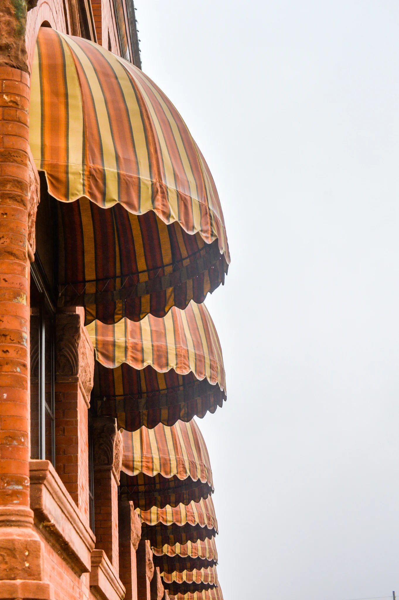 Downtown Harlan, Iowa has several historic buildings. This image is of some of the window canopy's on one of the buildings. I love the leading lines in this image!
