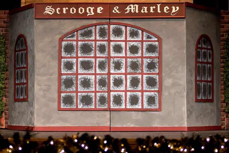 "Scrooge never painted out Old Marley's name. There it stood, years afterwards, above the warehouse door: Scrooge and Marley." The set that was created for this show is amazing. Buildings that opened or closed, doors that worked. Entryway from every possible area. A second story. What an amazing job that was done by the advanced stagecraft class, the crew, and the cast.