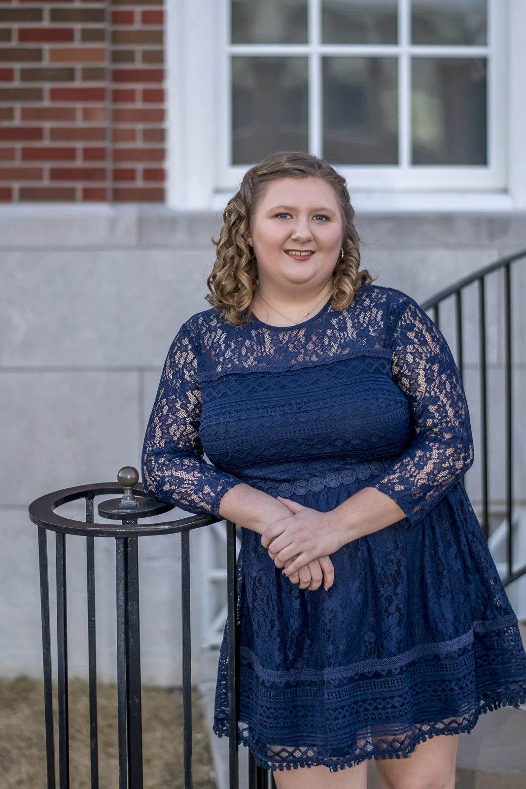 They had decided to take their pictures at "The Square" in Independence. There are many great places to pose and get some good images there. This wrought iron railing worked perfectly for them to lean against.