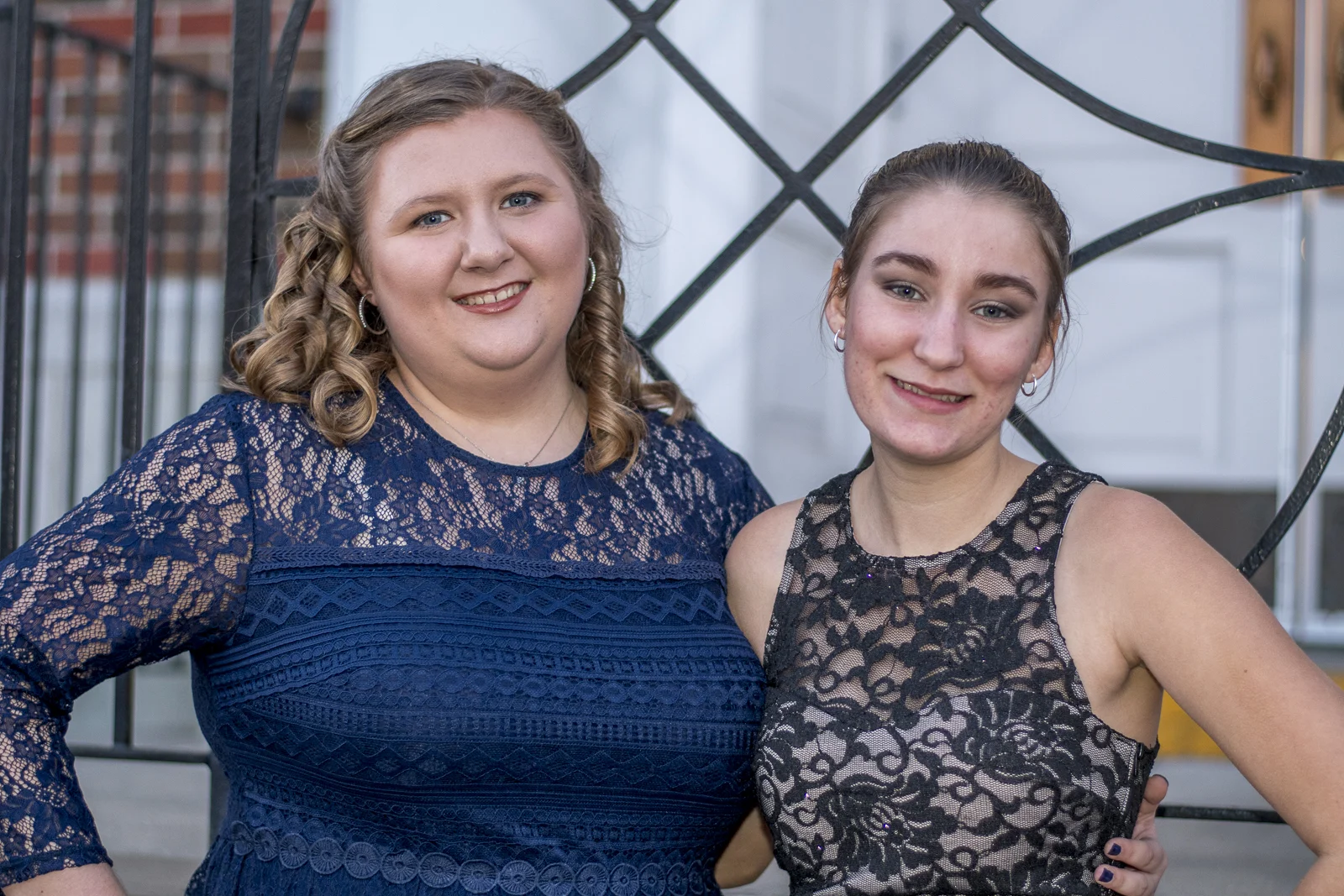 A great picture of two friends, but I wish that I would have thought more about the background. They should have been centered on the fence and the doors in the background. Oh well, that's why I'm an amature.