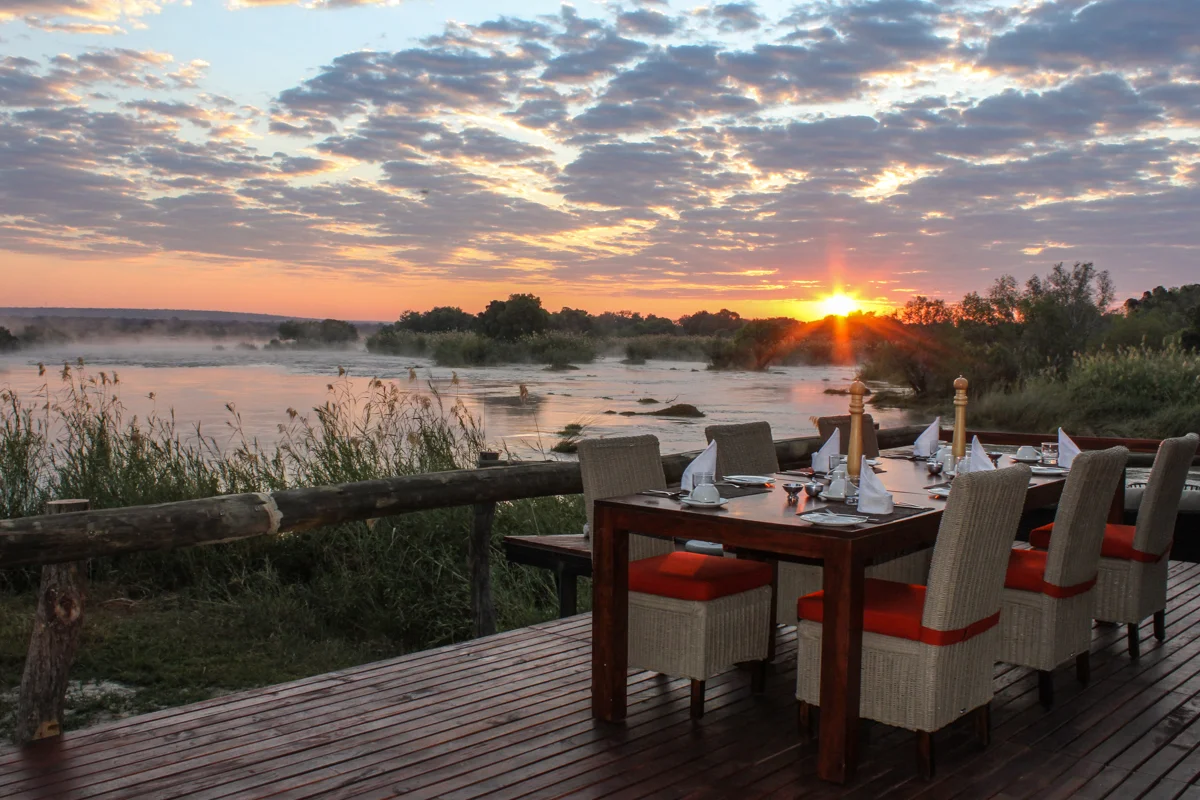 18. Imvelo Safari Lodges - Zambezi Sands - Breakfast table at sunrise.jpg