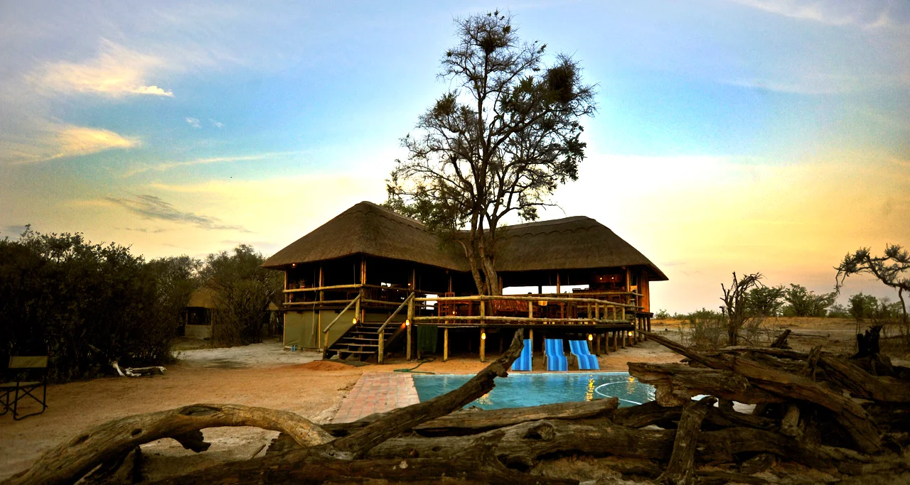 Enjoying a sundowner poolside. Overnight: Nehimba Lodge Meals: B | L | D